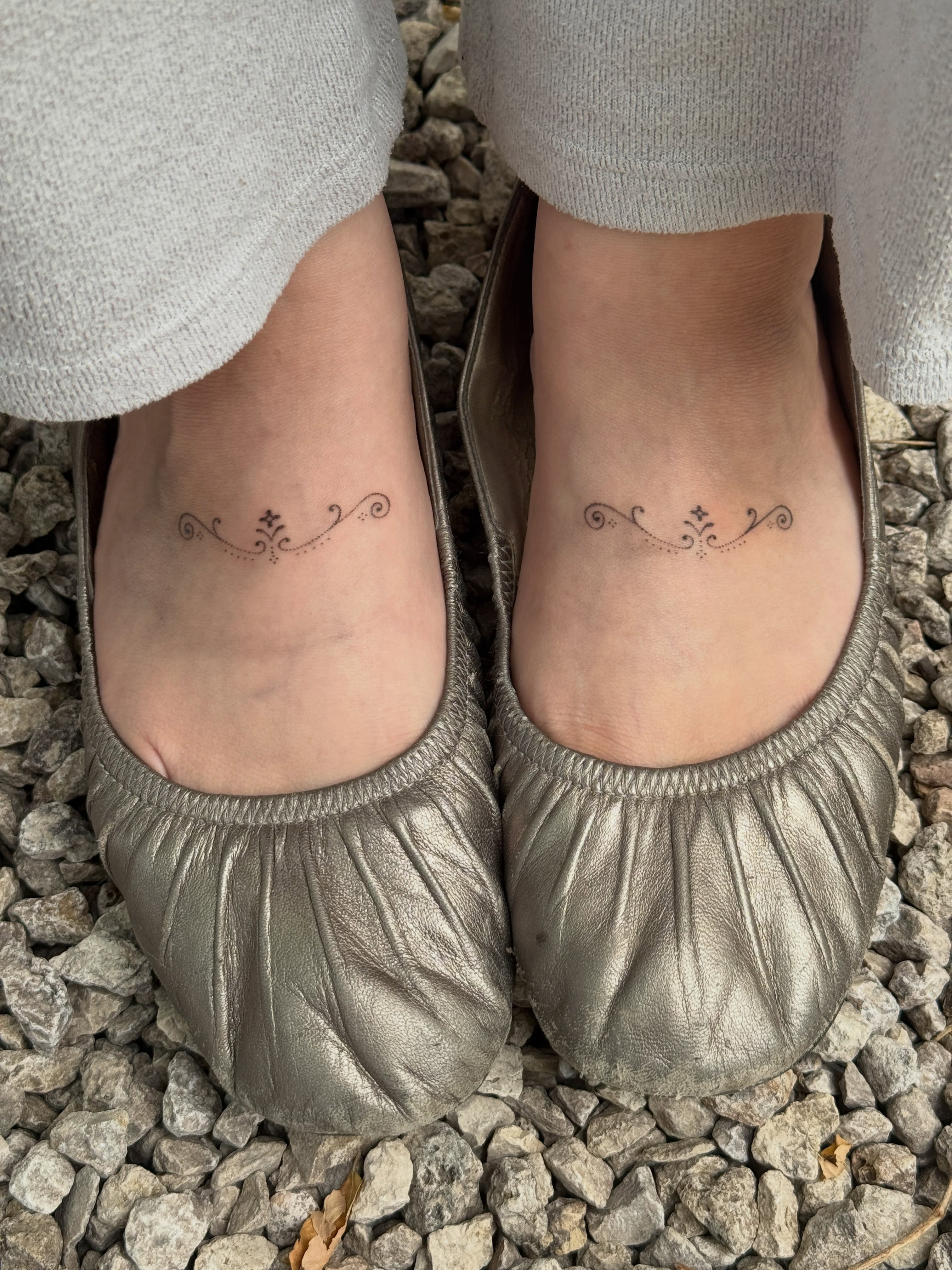 Floral ornament fine line tattoo on the foot by springgreens