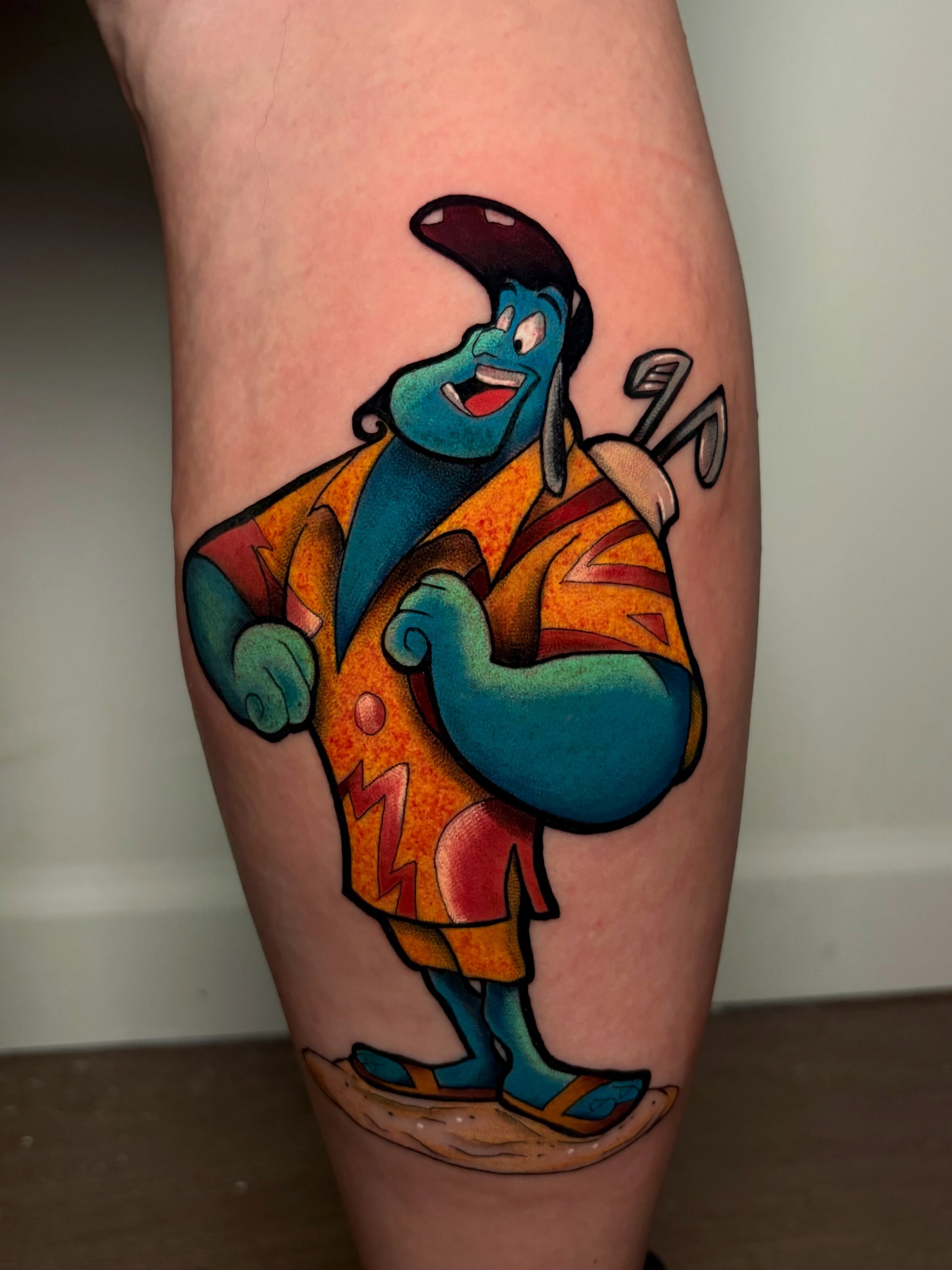Golfing character new school tattoo on the leg by Jess