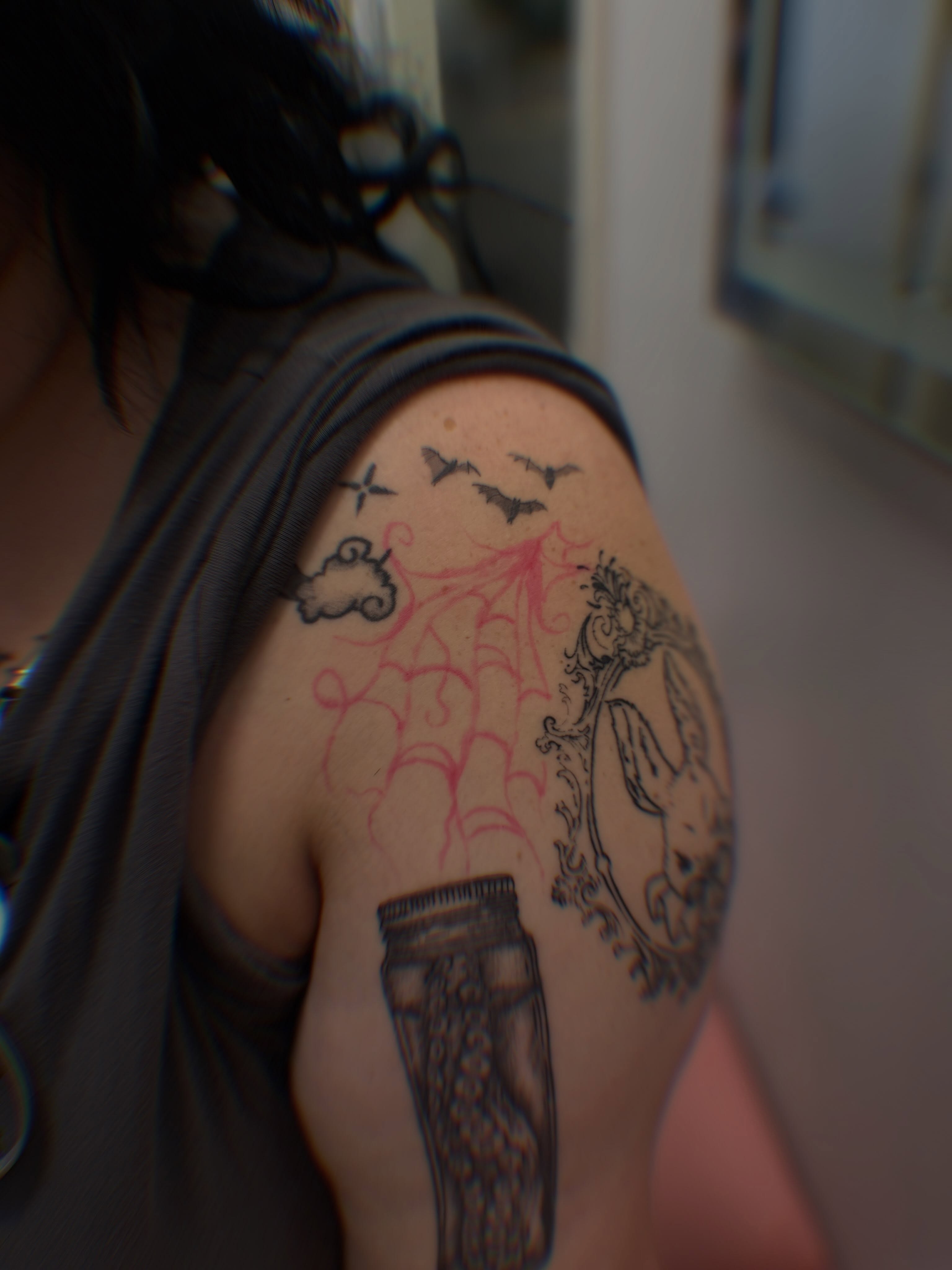 Octopus and jar black and grey tattoo on the shoulder by Brinkley McGill