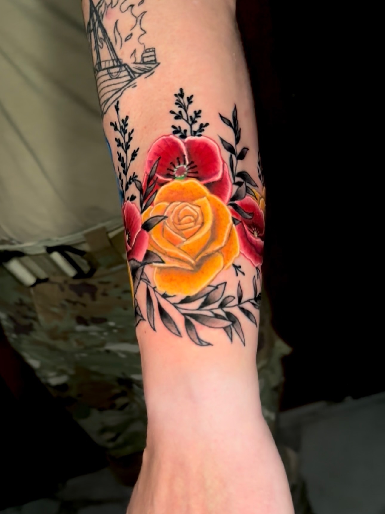 Floral arrangement American traditional tattoo on the forearm by Goga