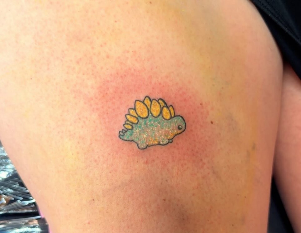 Stegosaurus new school tattoo on the shoulder by Felicia Lee, Des Moines, Iowa