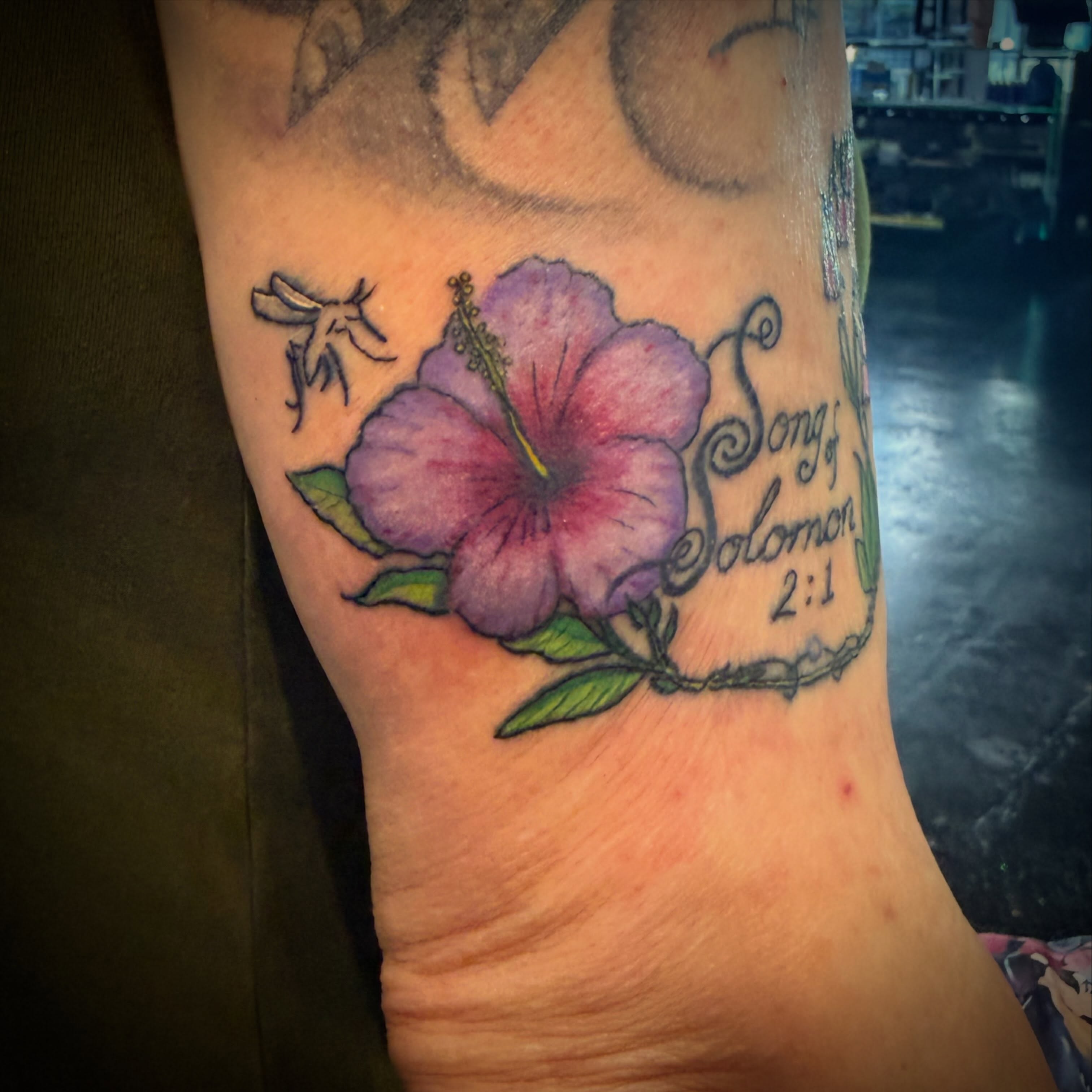 Hibiscus flower realism tattoo on the forearm by Darby Antonucci