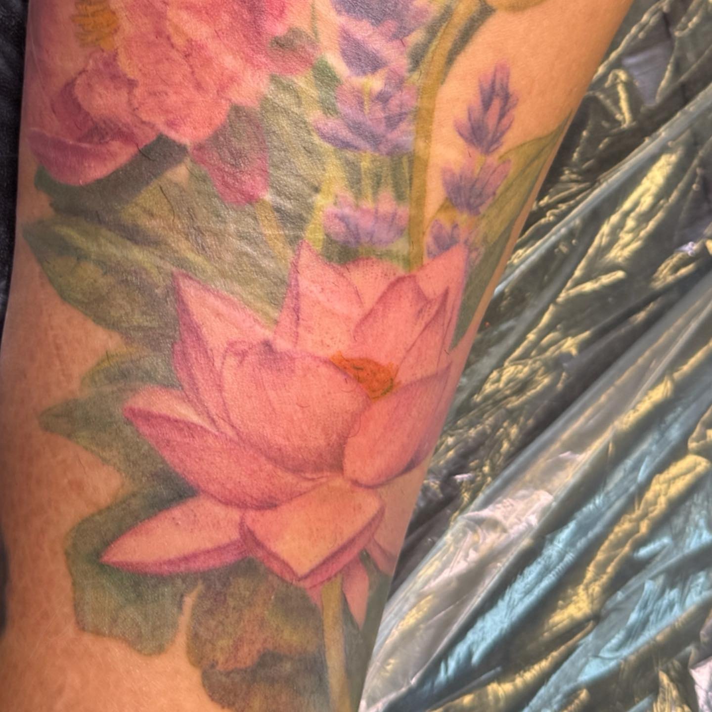 Lotus flower realism tattoo on the forearm by PxINK, Crystal, Minnesota