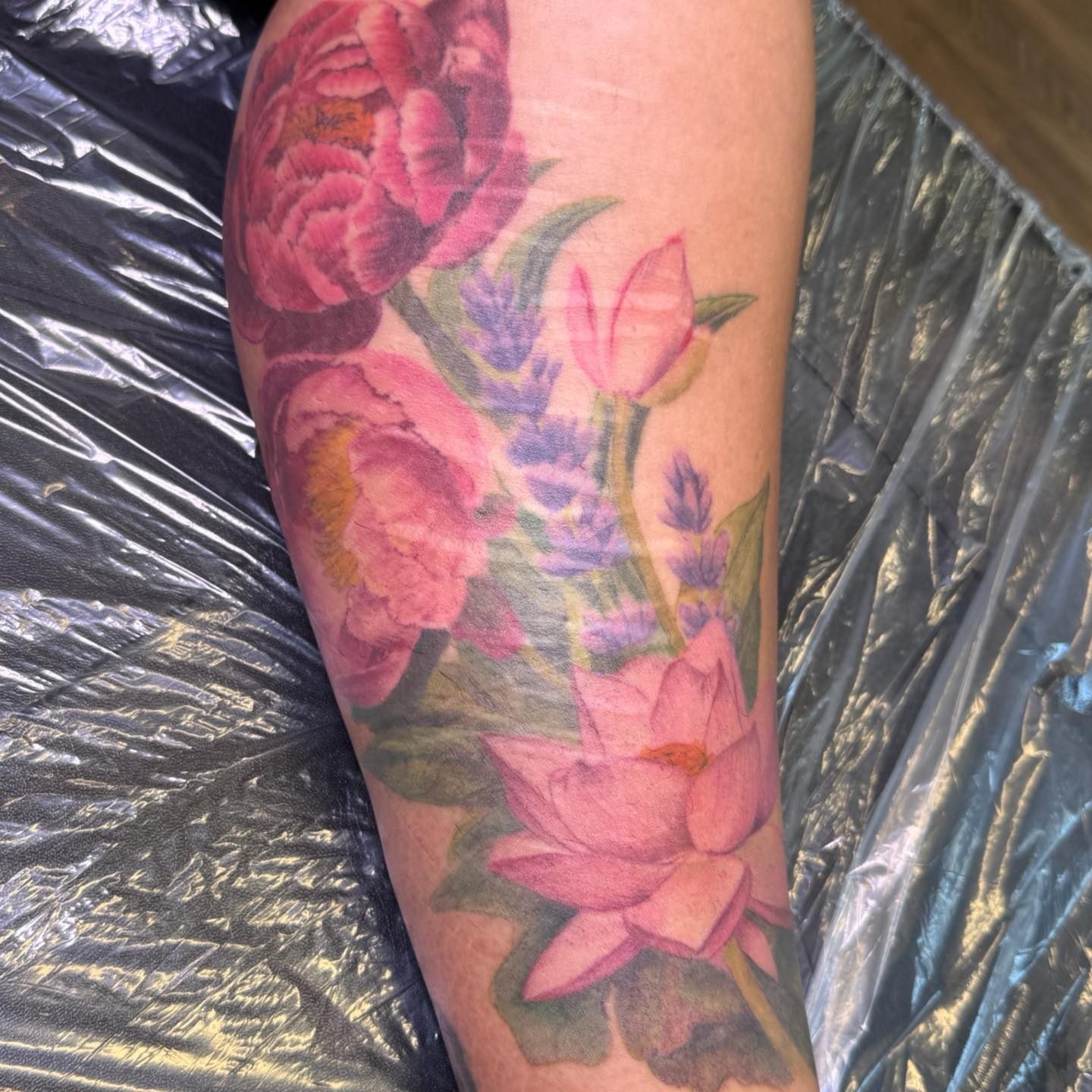 Floral bouquet watercolor tattoo on the forearm by PxINK, Crystal, Minnesota