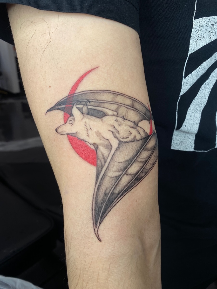 Bat black and grey tattoo on the forearm by Nikole