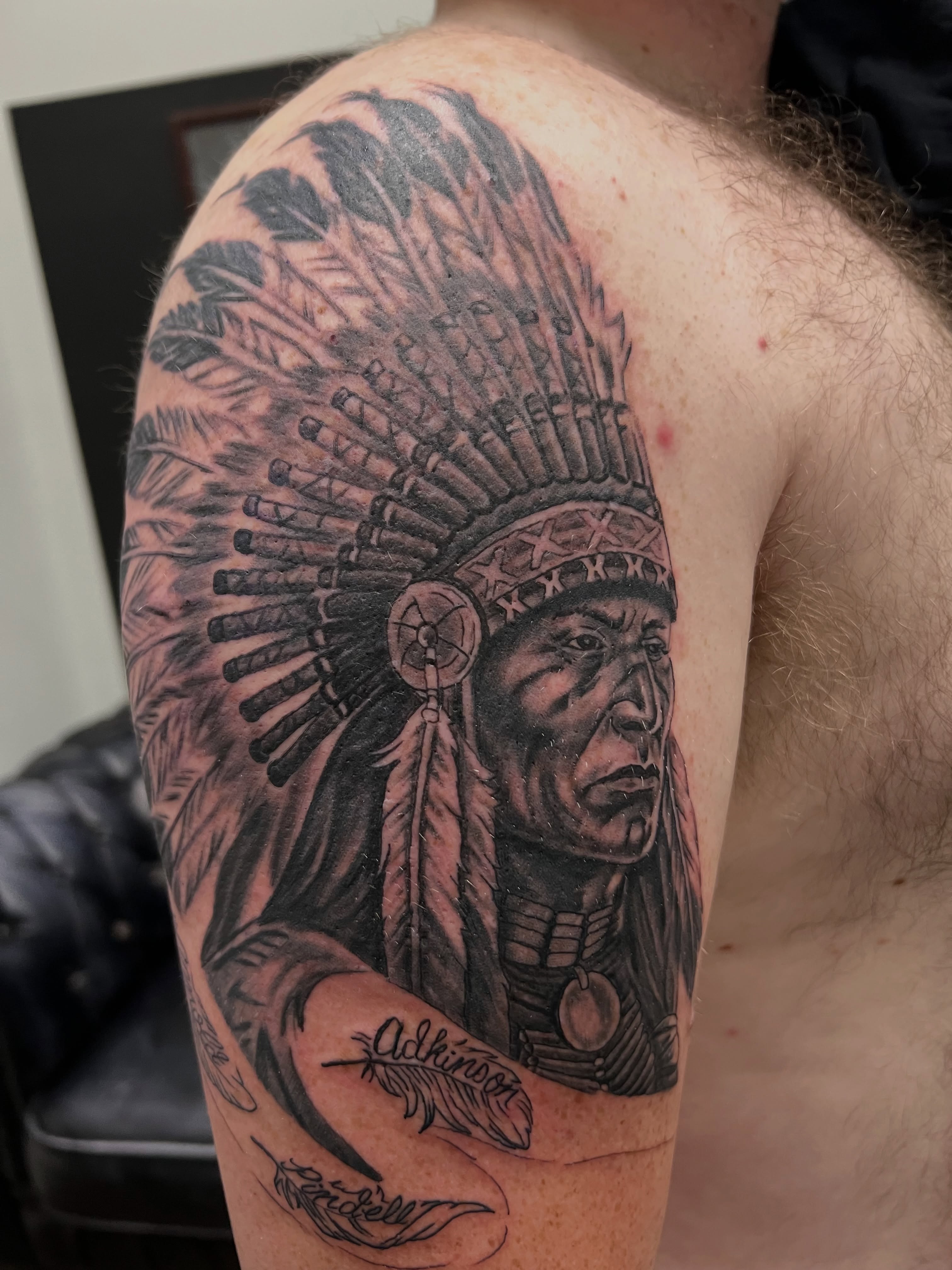 Native american chief headdress realism tattoo on the shoulder by A.W.