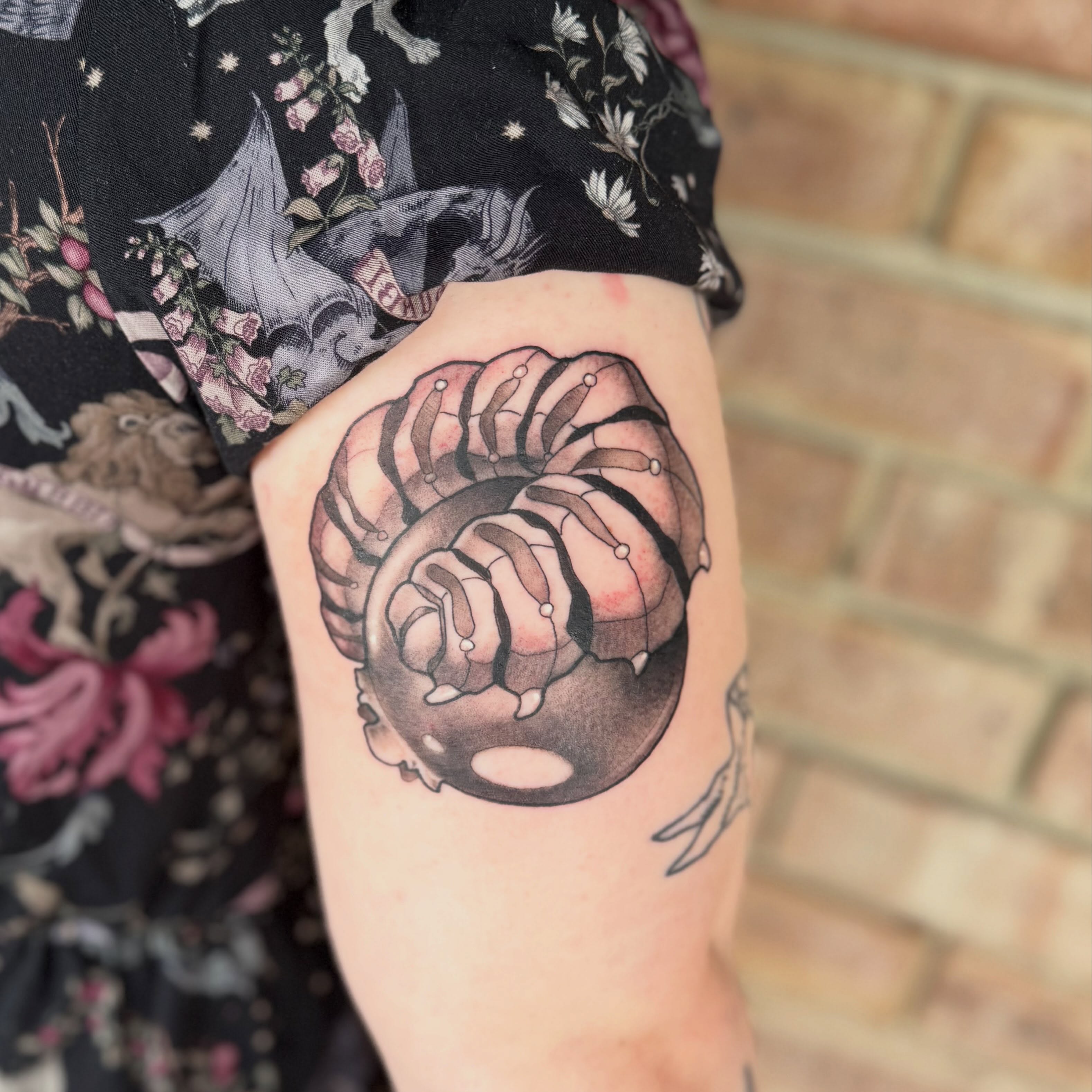 Mechanical gear black and grey tattoo on the forearm by Nathan Evans