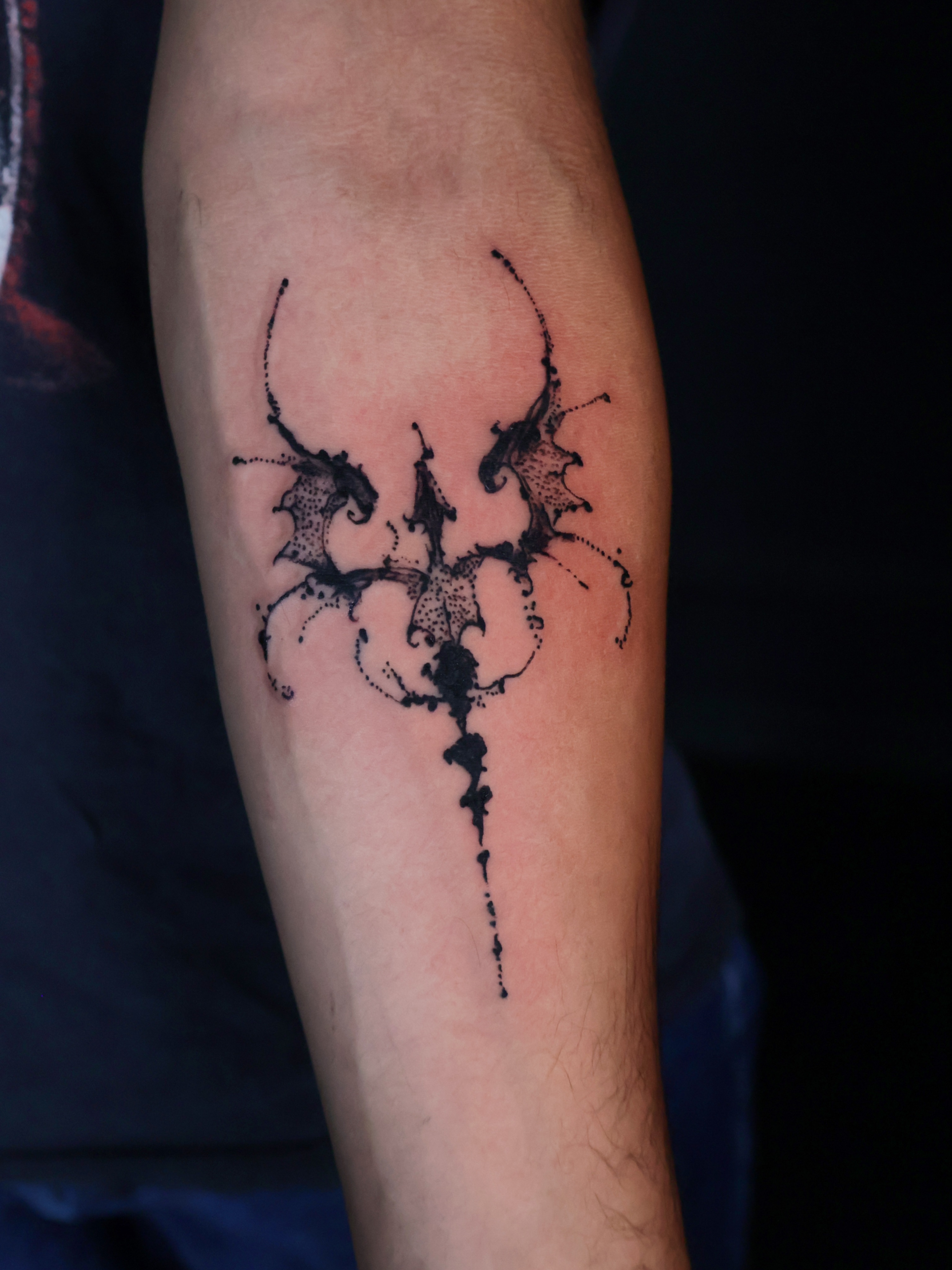 Abstract splatter dotwork tattoo on the forearm by Denis Du Preez, East Williamsburg, Brooklyn