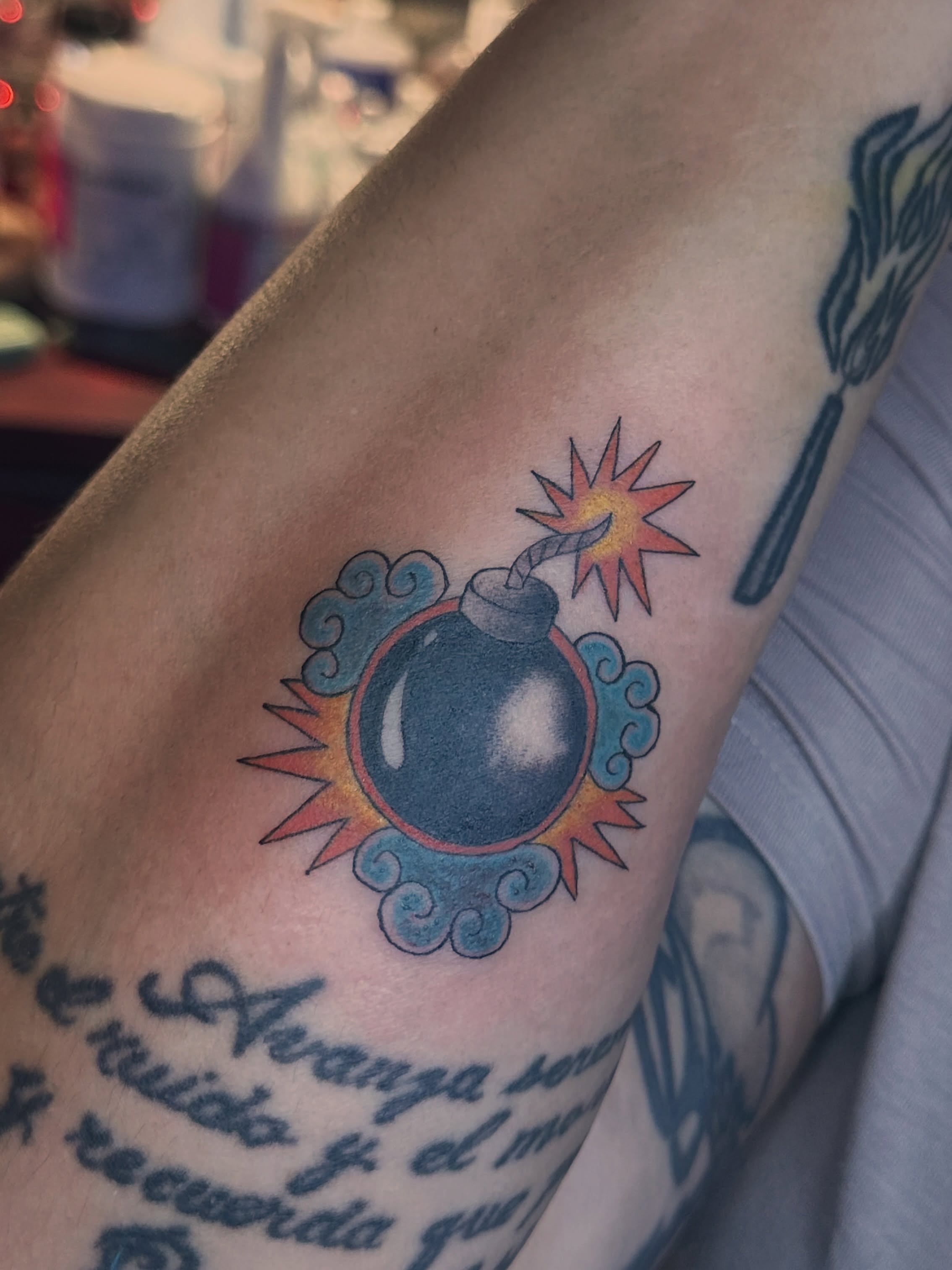 Bomb American traditional tattoo on the forearm by Lunette : a little moon as simple as that