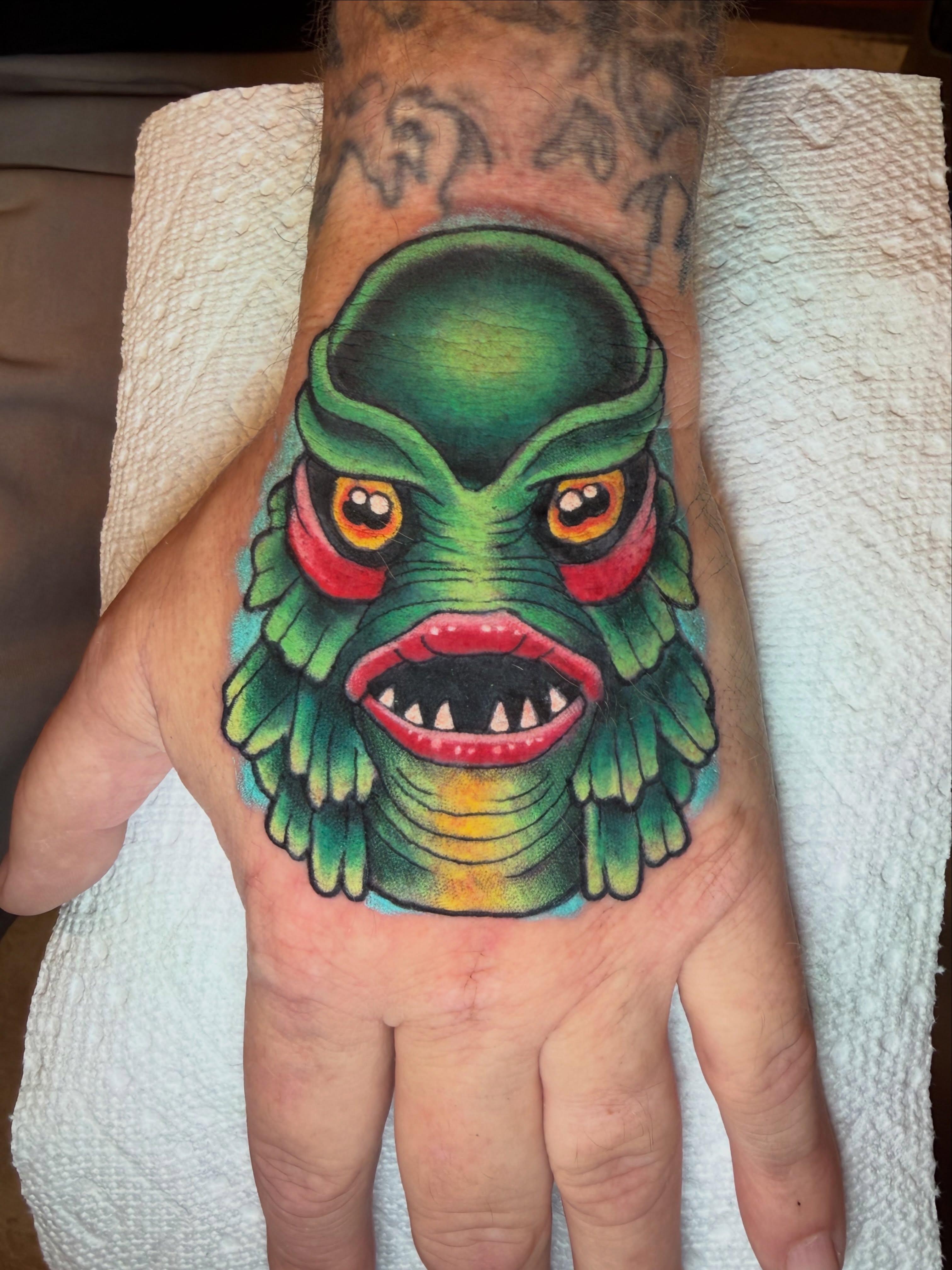 Monster head American traditional tattoo on the hand by James Mullin