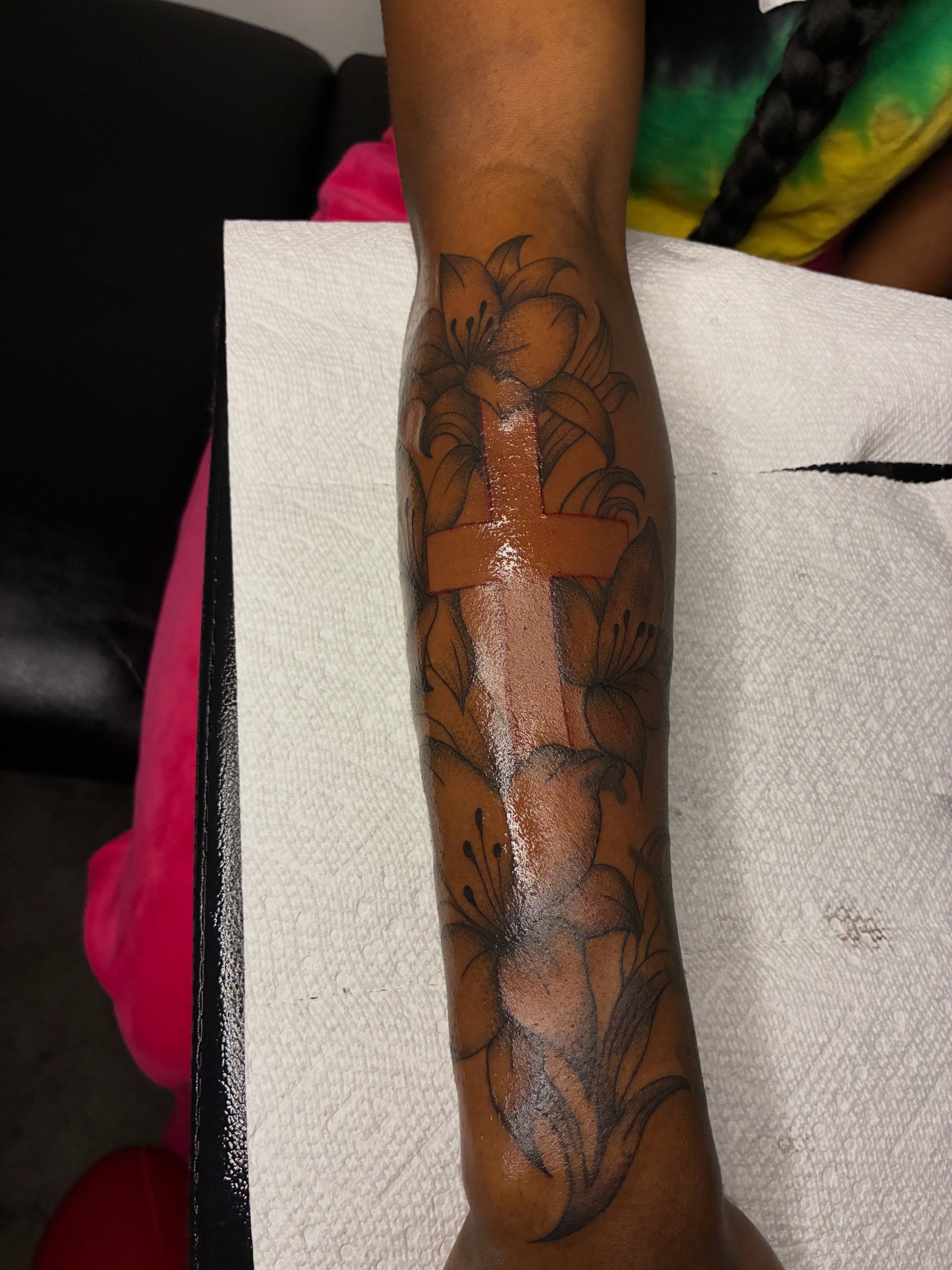 Cross with lilies black and grey tattoo on the forearm by ɪɪɴᴋᴇᴅʙʏʀᴇɴɴ🐉