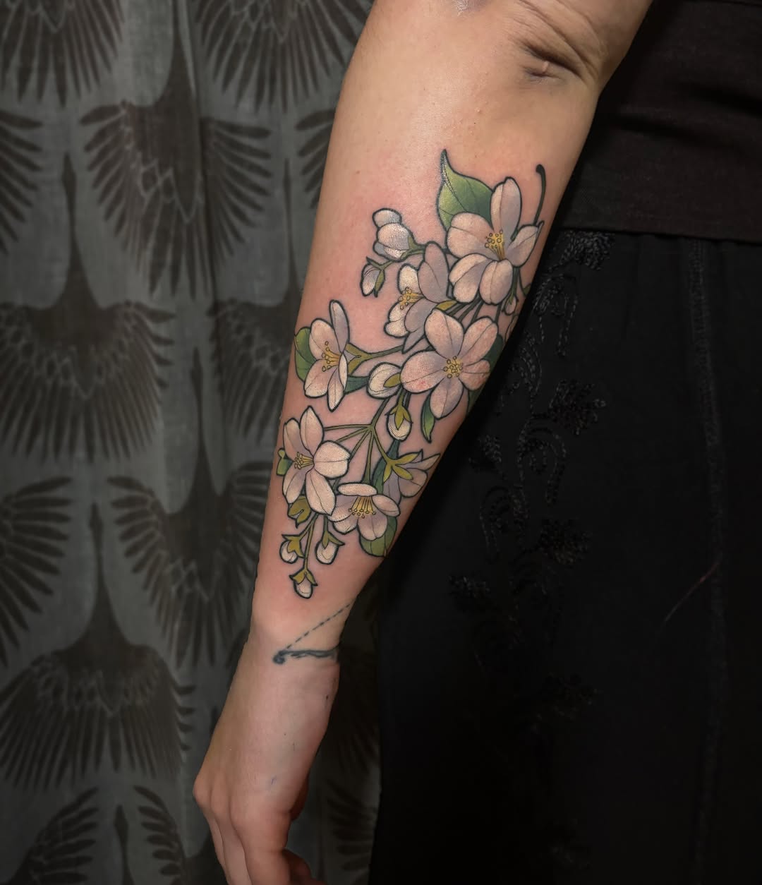 Cherry blossoms realism tattoo on the forearm by Alex