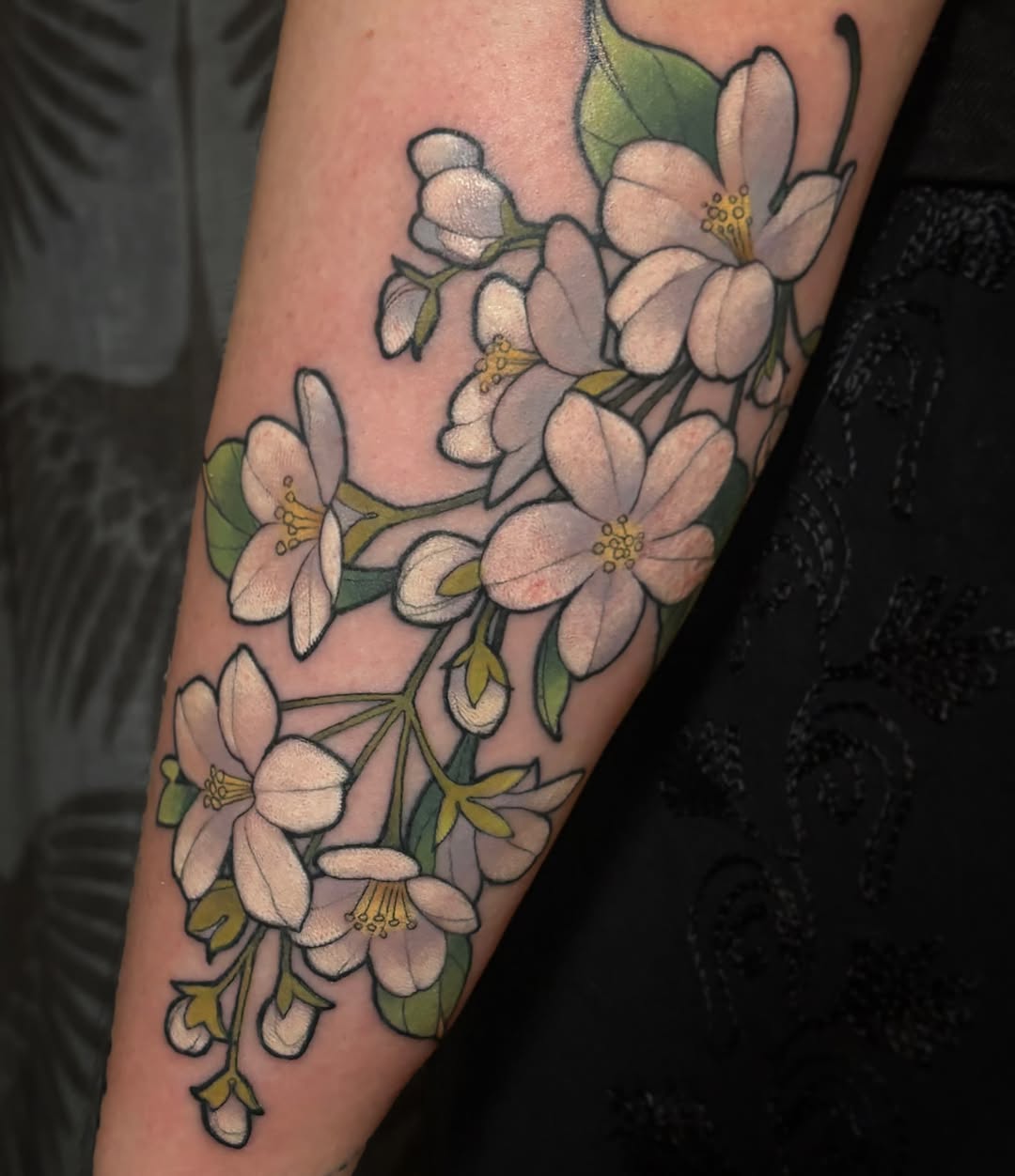 Cherry blossoms realism tattoo on the forearm by Alex