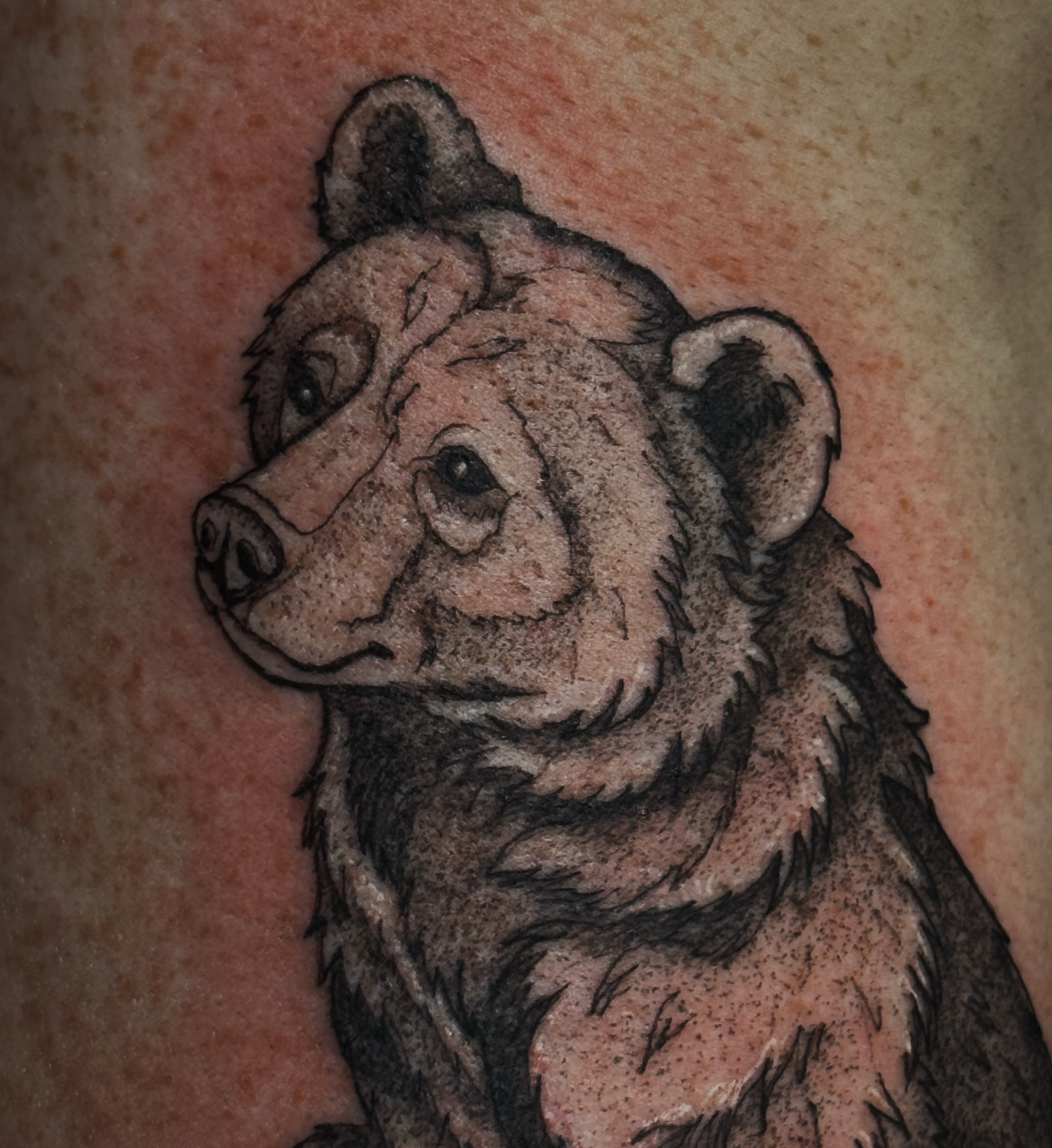Bear black and grey tattoo on the upper arm by Kaylee Castleton, Tooele, Utah