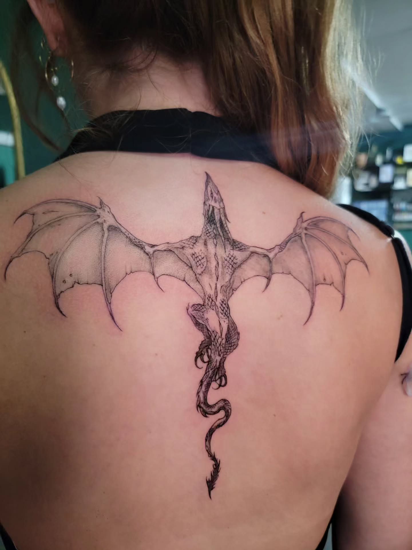 Dragon dotwork tattoo on the back by Nathan Harkins-Oberbeck