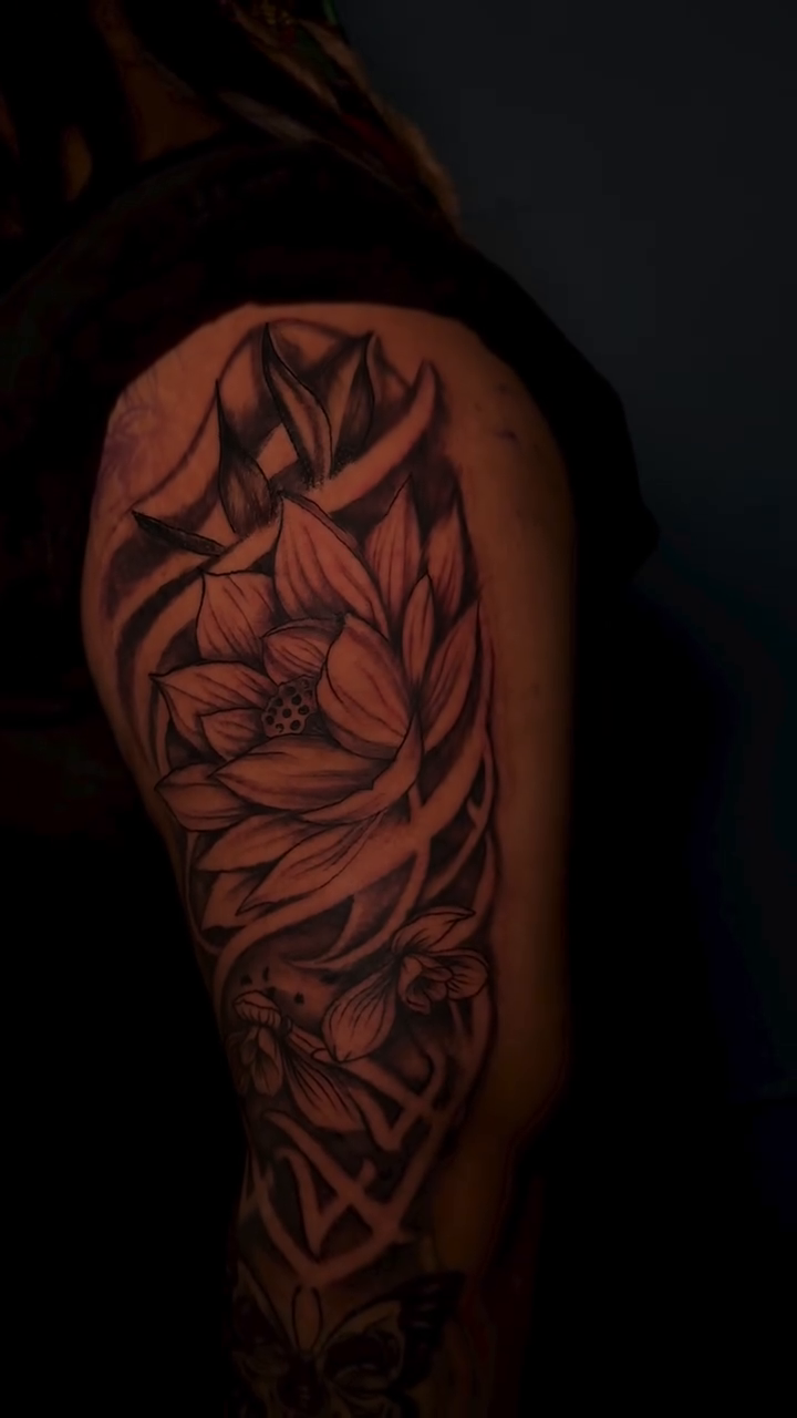 Floral and ornamental sleeve realism tattoo by Dope