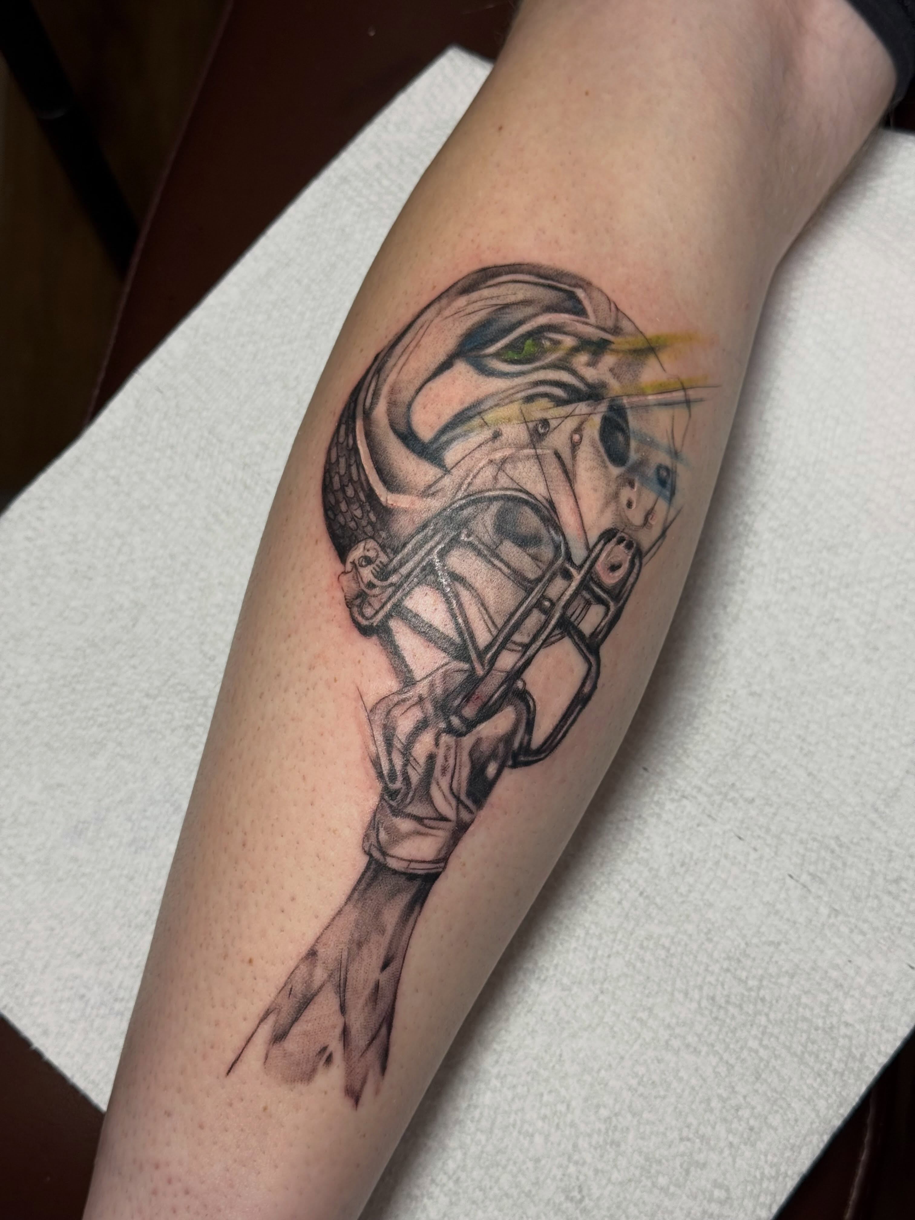 Stormtrooper helmet black and grey tattoo on the forearm by Lauren Horness