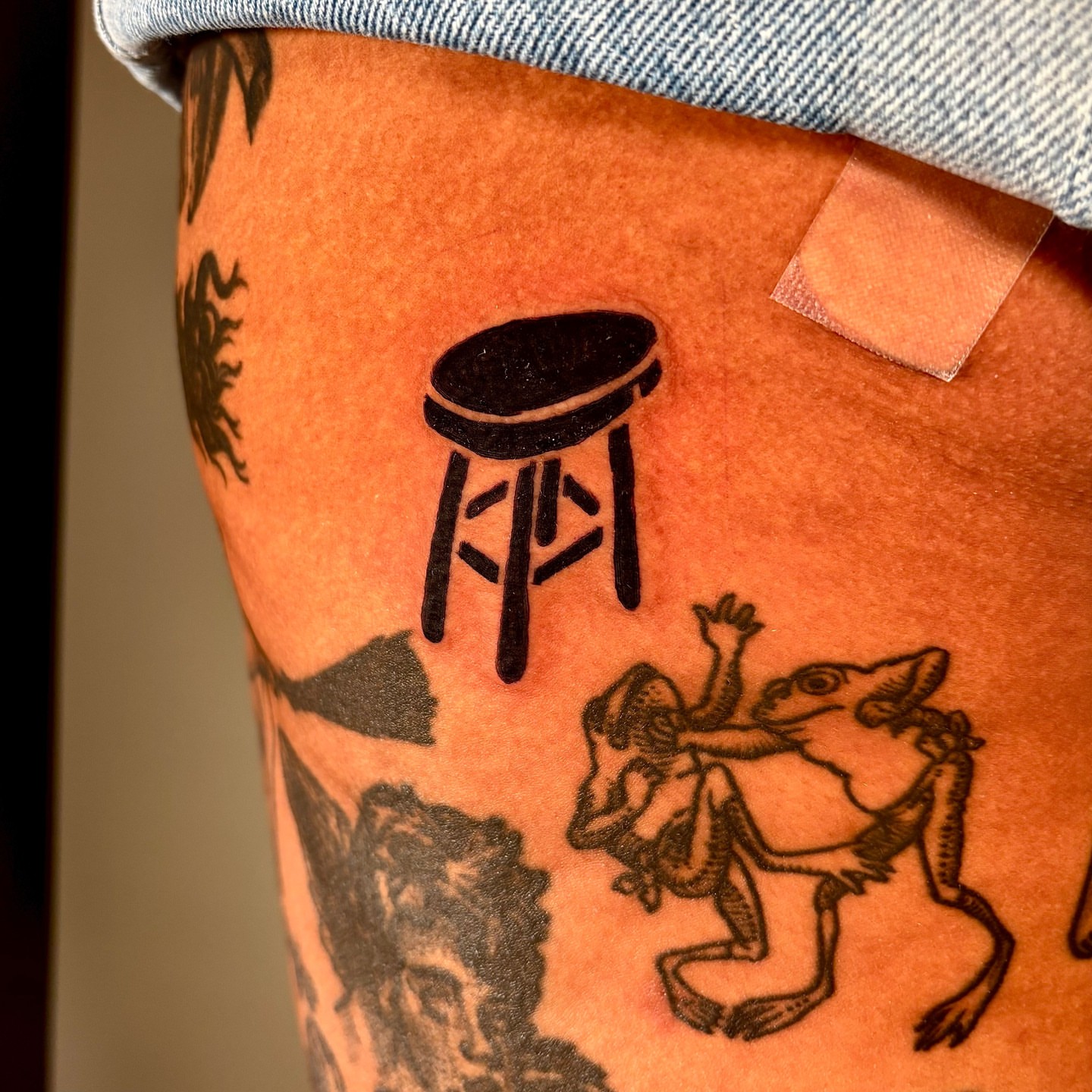Bar stool black and grey tattoo on the thigh by ๐๐๐ ๐๐๐๐๐๐๐๐๐๐๐
