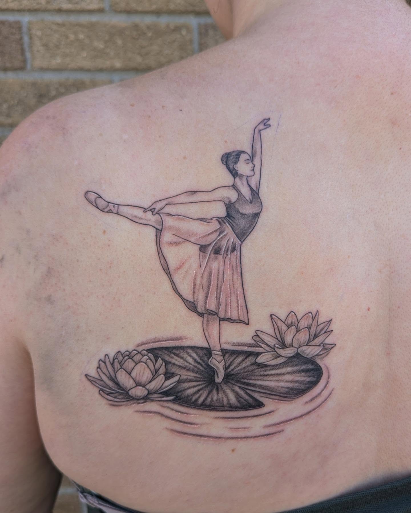 Ballerina on lily pad realism tattoo on the back by Hannah Hayes, Livonia, Michigan