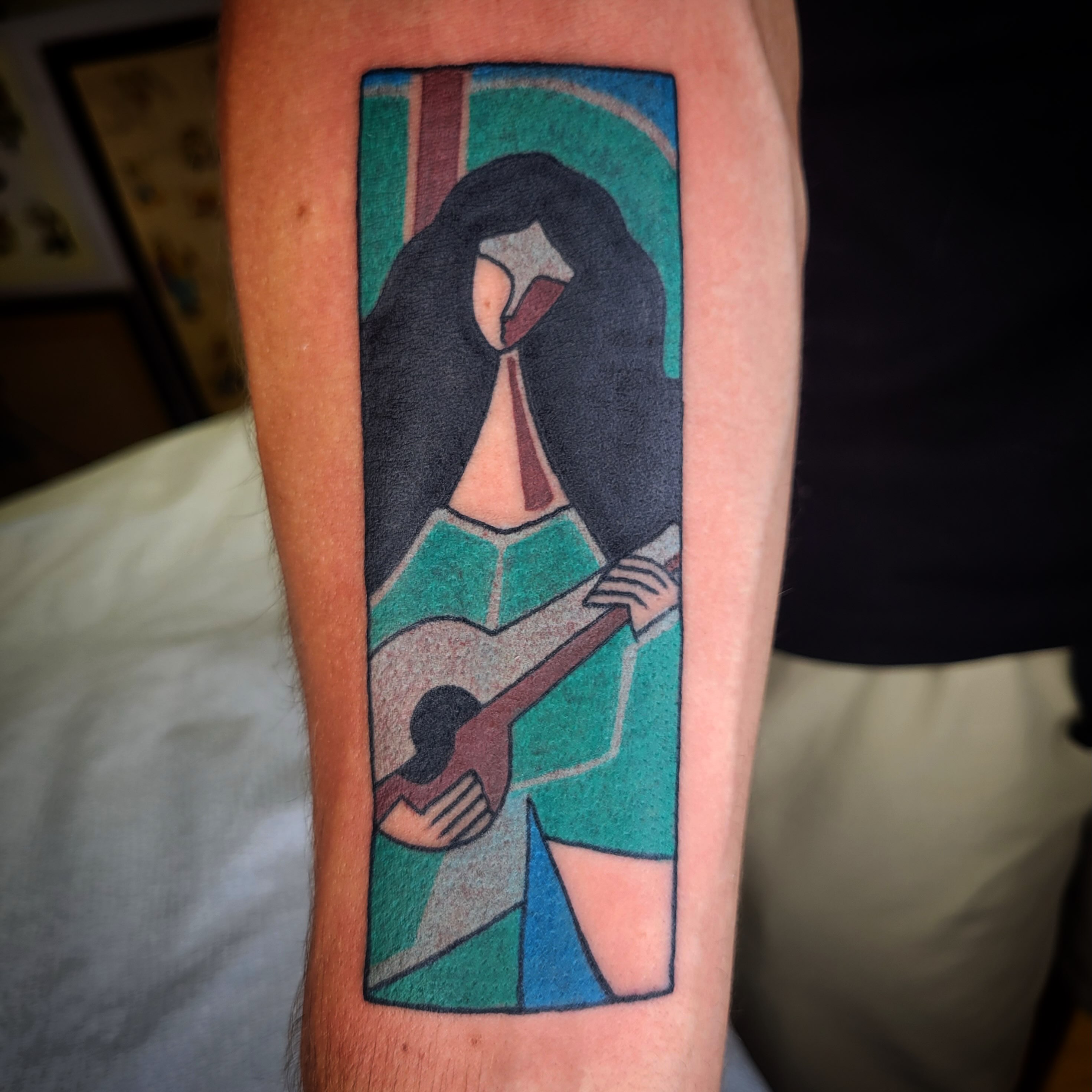 Woman playing guitar geometric tattoo on the forearm by joe martinez, Denver, Colorado