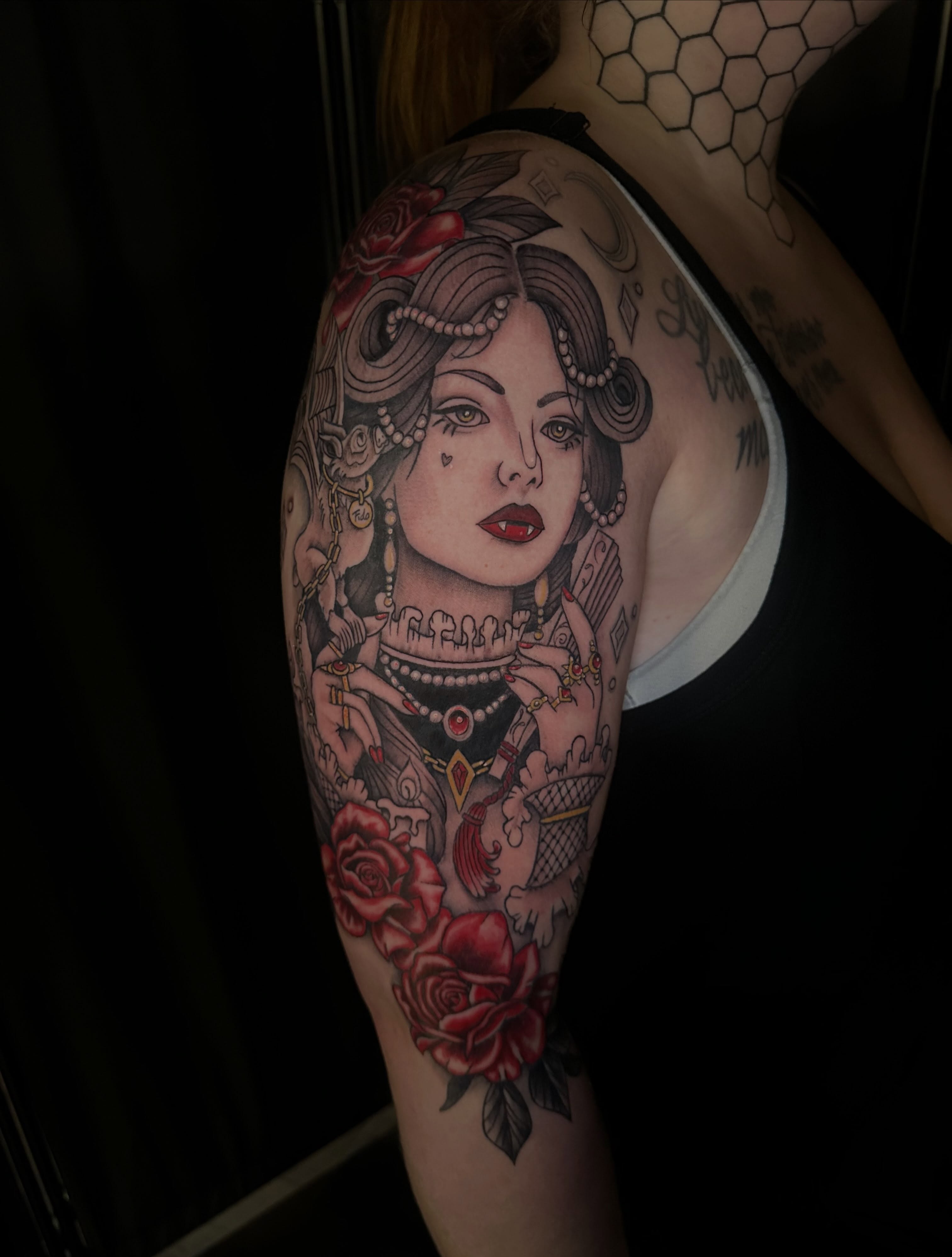 Woman with roses American traditional tattoo on the shoulder by Lindsey Bendsey