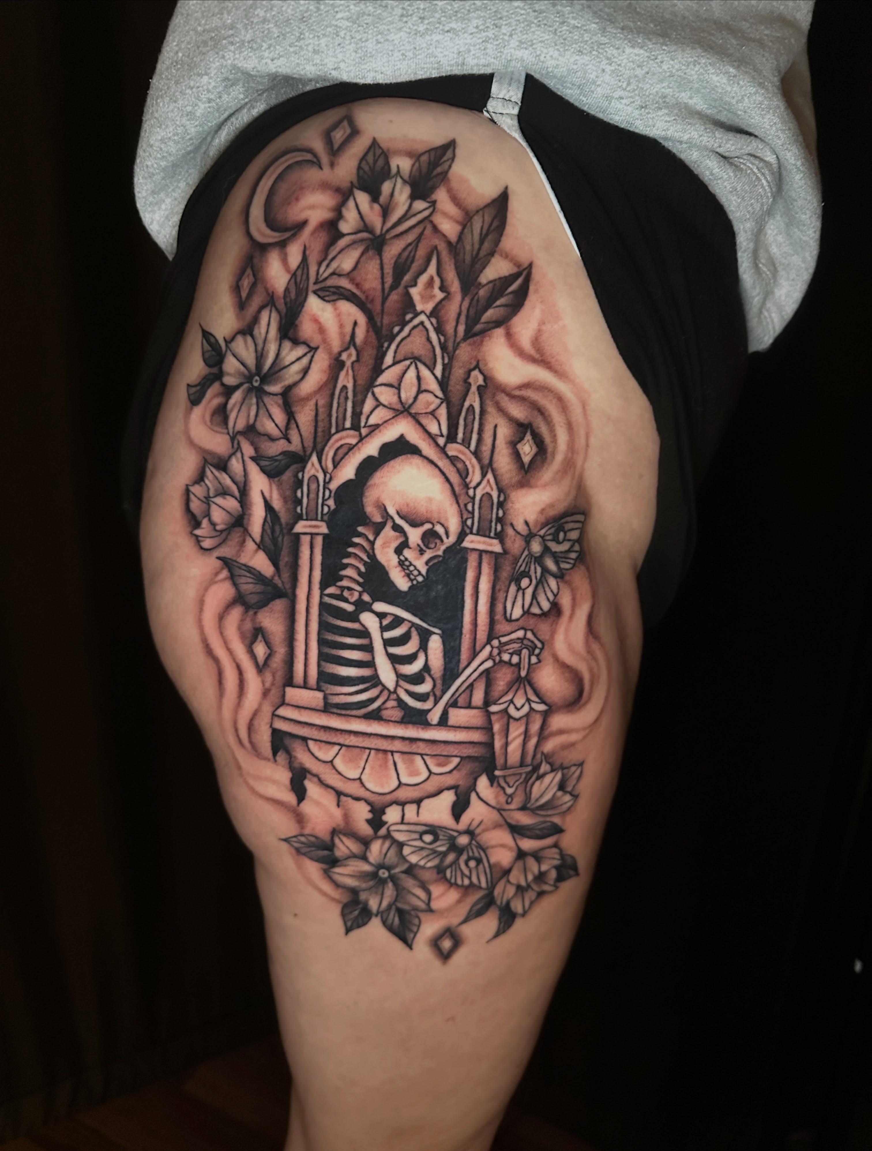 Skeleton in throne realism tattoo on the thigh by Lindsey Bendsey