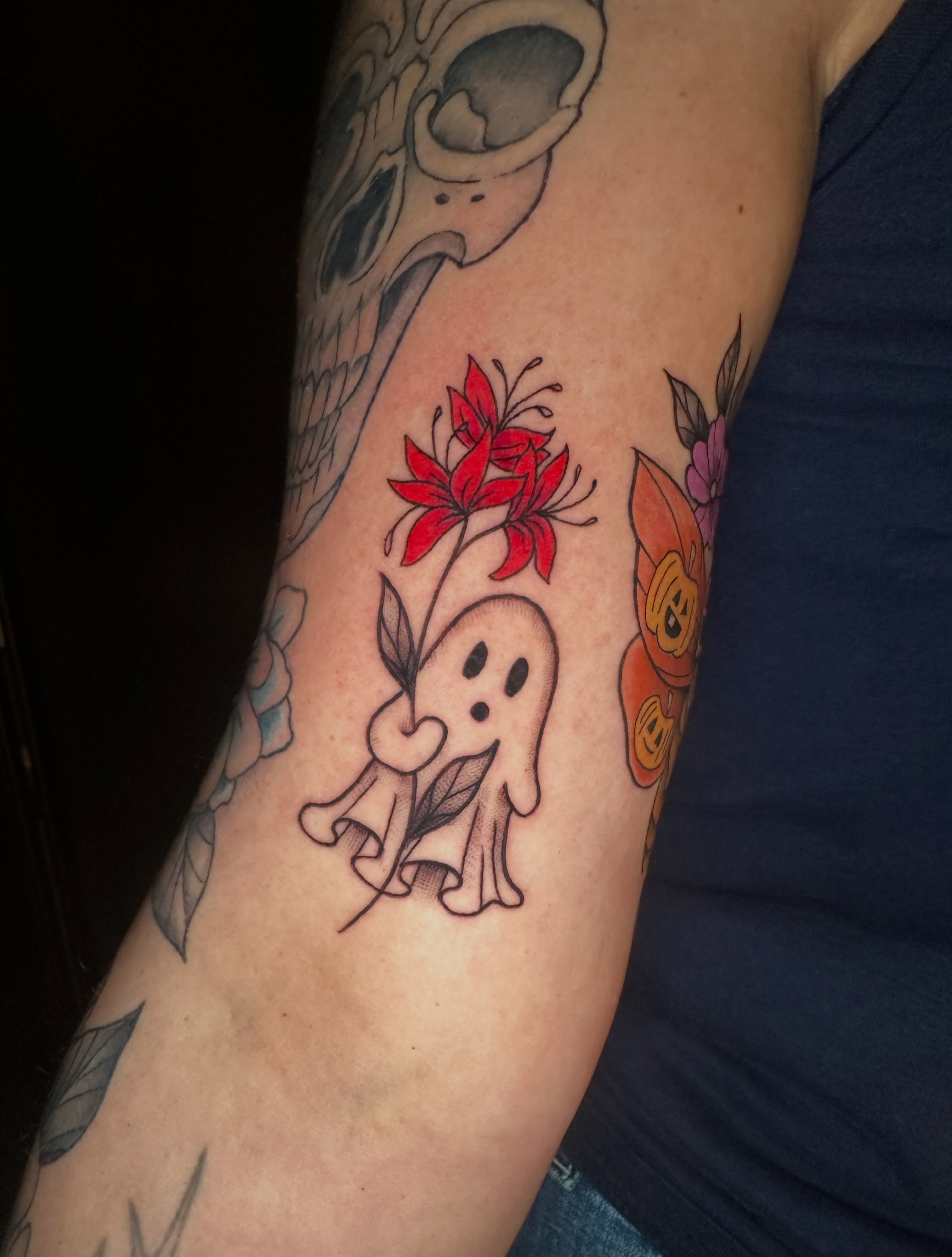 Ghost with flowers dotwork tattoo on the forearm by Lindsey Bendsey