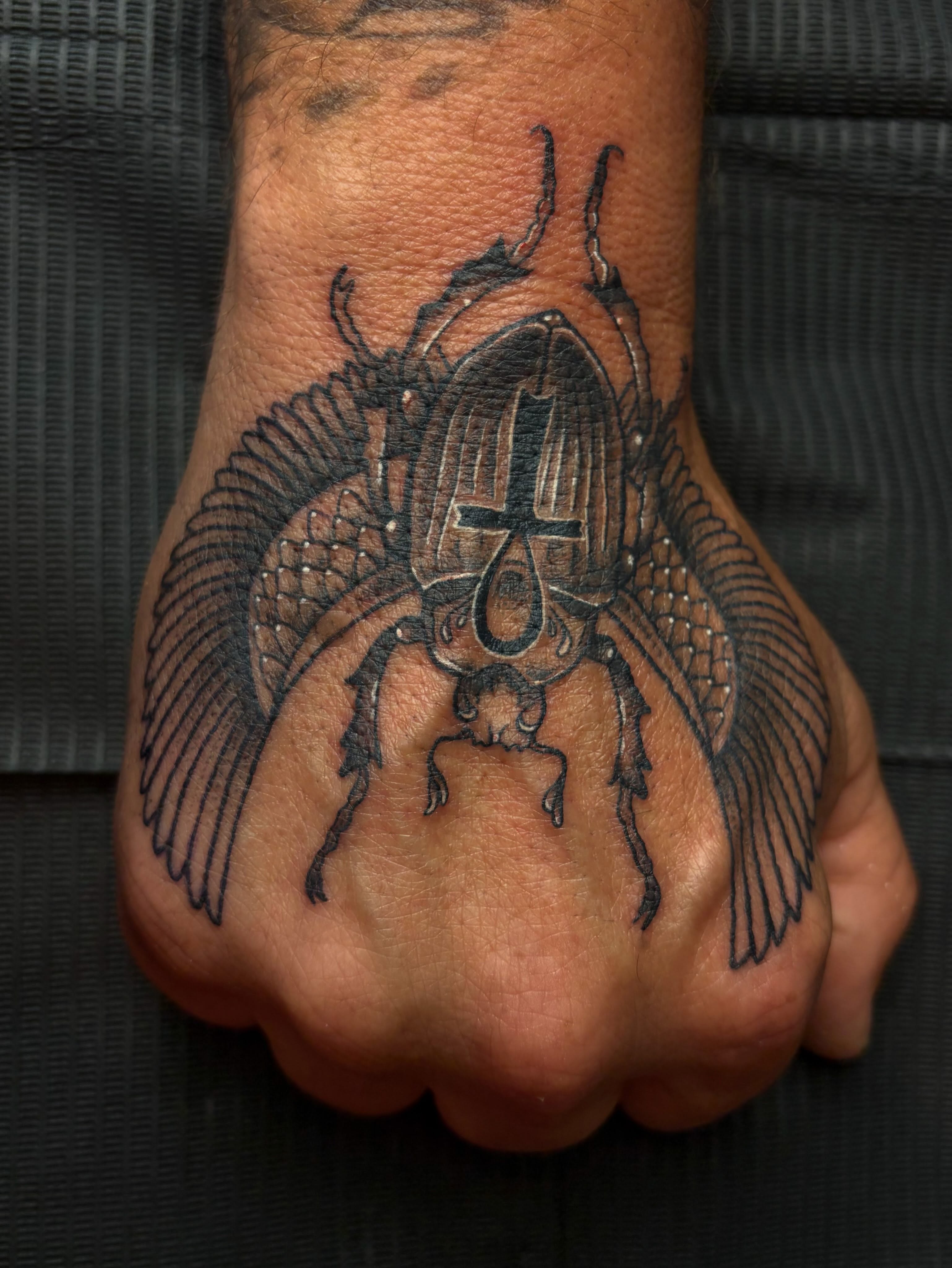 Winged knight black and grey tattoo on the hand by destany aguilera, Davenport, Iowa