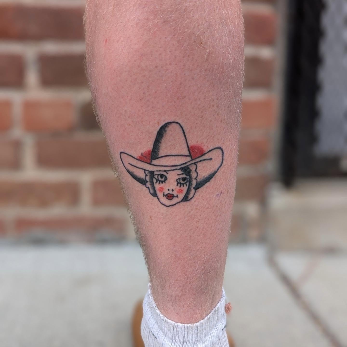 Cowgirl American traditional tattoo on the forearm by Jon Sedor