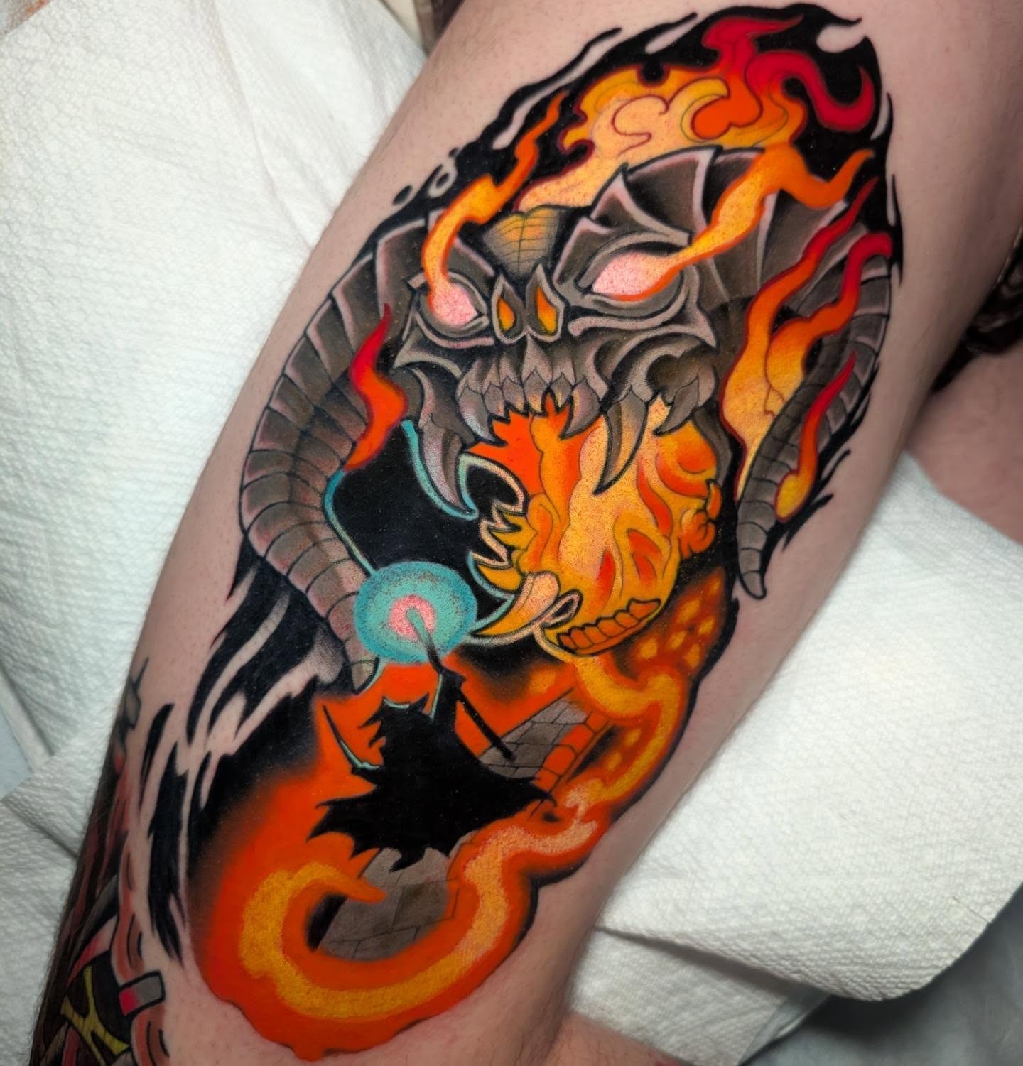 Demon skull American traditional tattoo on the forearm by Ellie