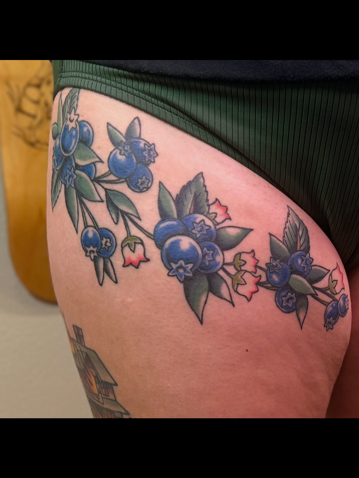 Blueberries neo-traditional tattoo on the thigh by Ethan, Toledo, Ohio