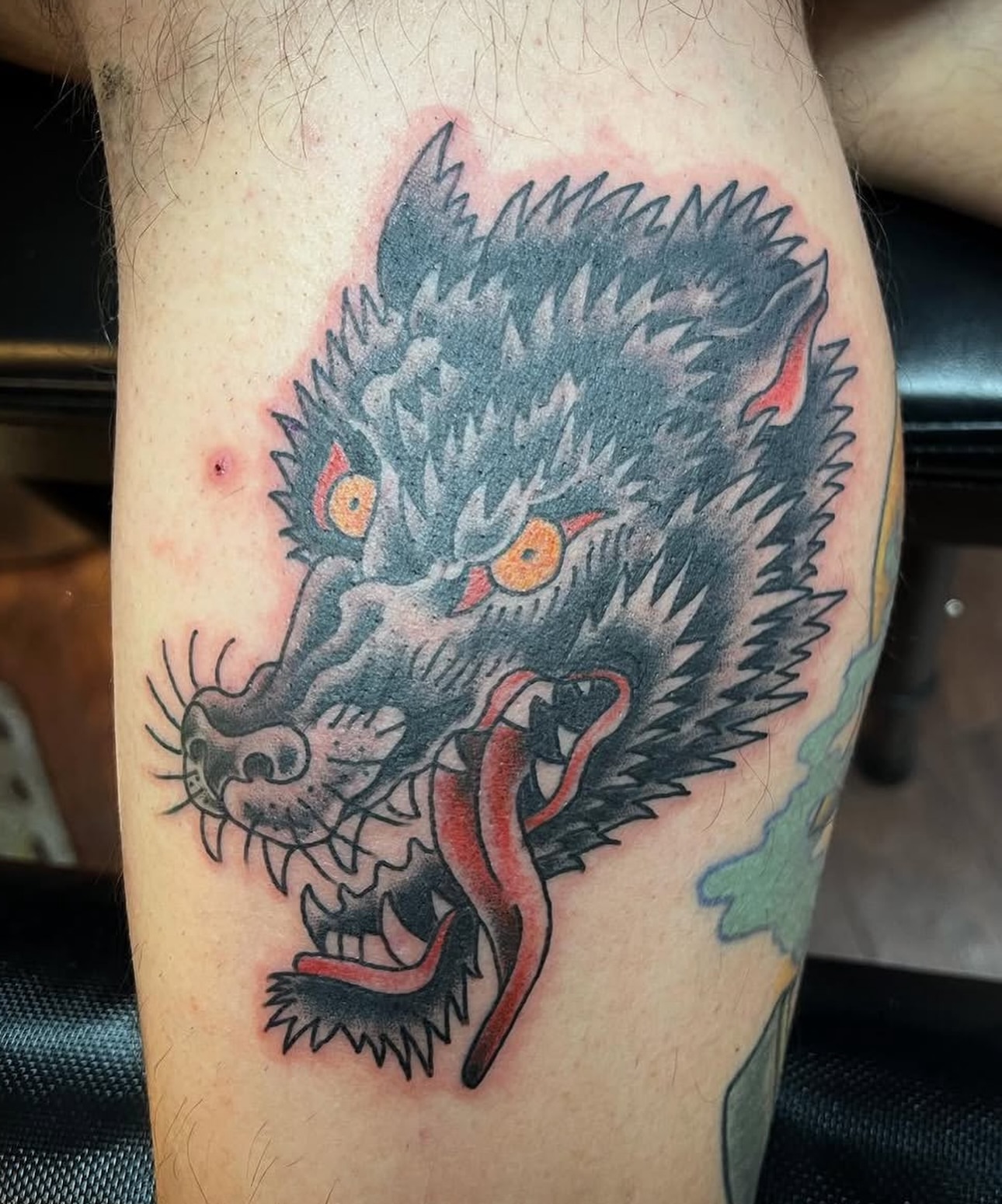 Wolf American traditional tattoo on the forearm by Keith Underwood