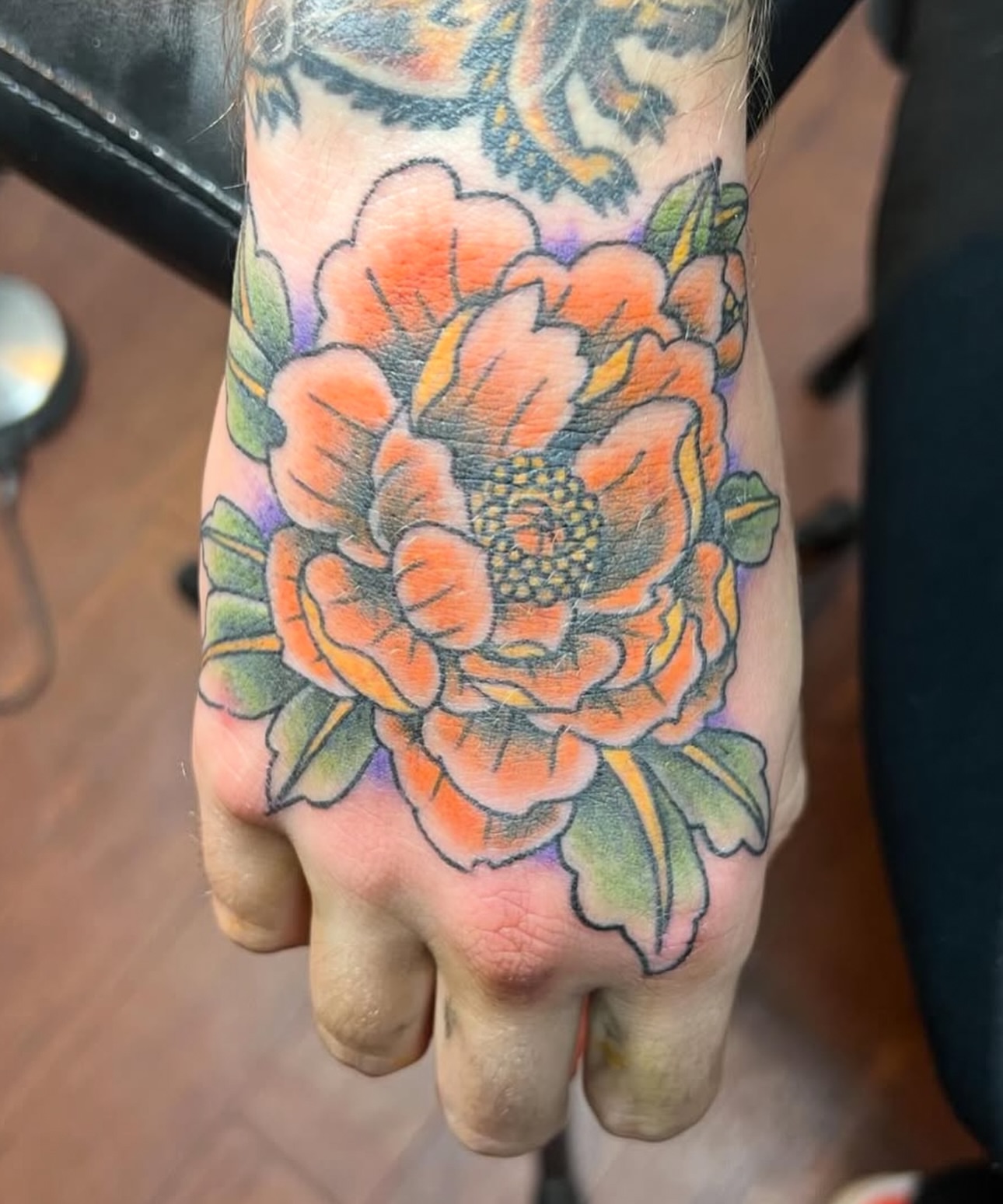 Peony American traditional tattoo on the hand by Keith Underwood