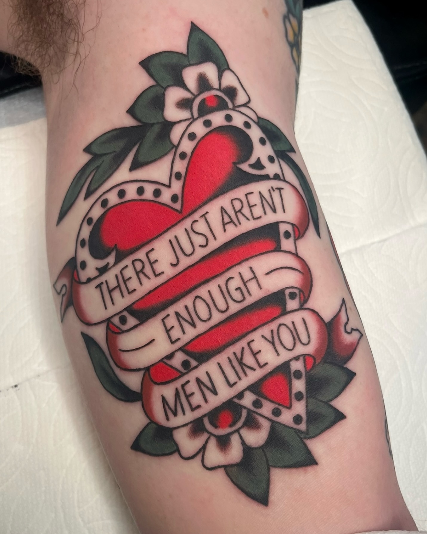 Heart with ribbon American traditional tattoo on the forearm by Tiffani Thompson, San Diego, California