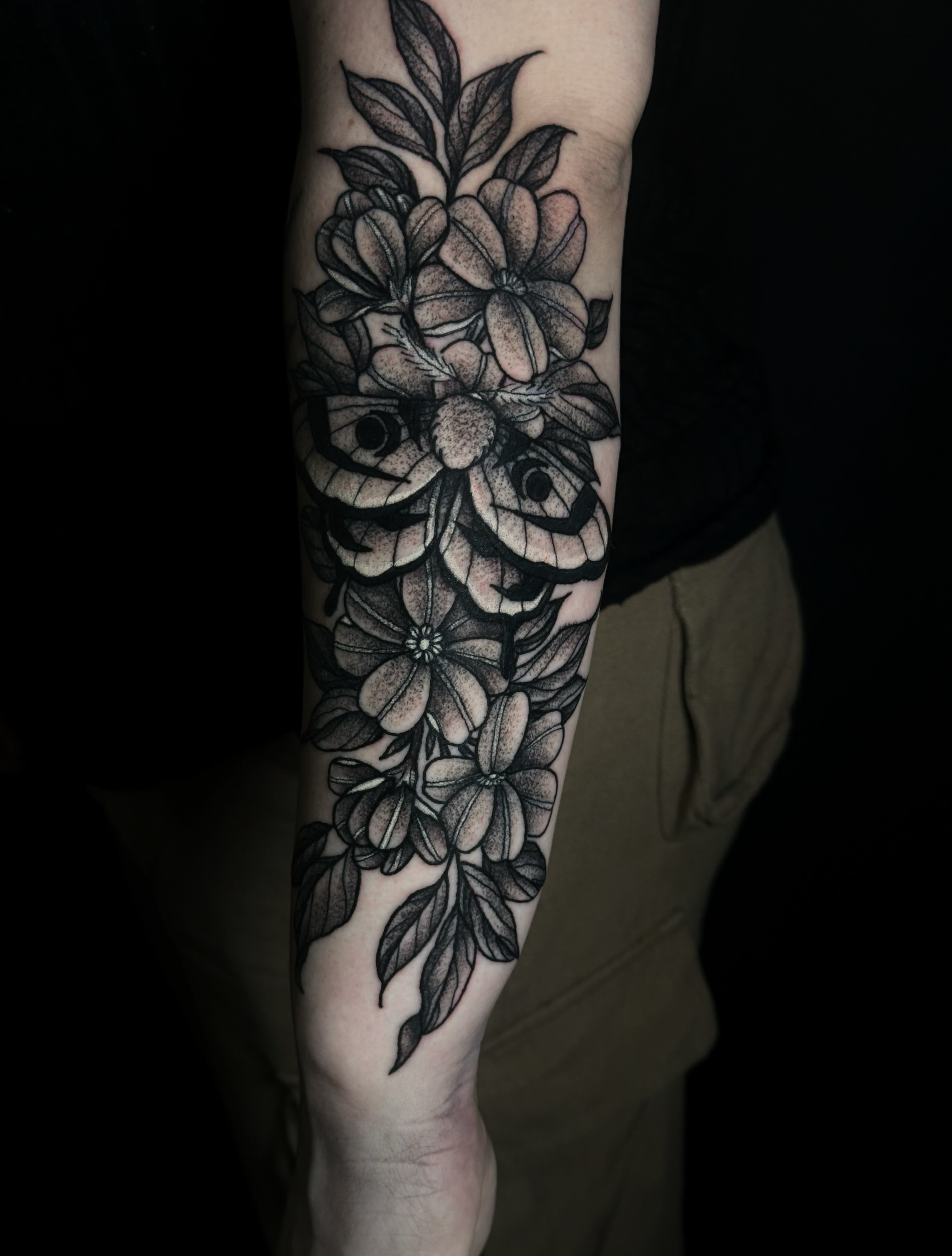 Floral arrangement dotwork tattoo on the forearm by Elizabeth Tabler