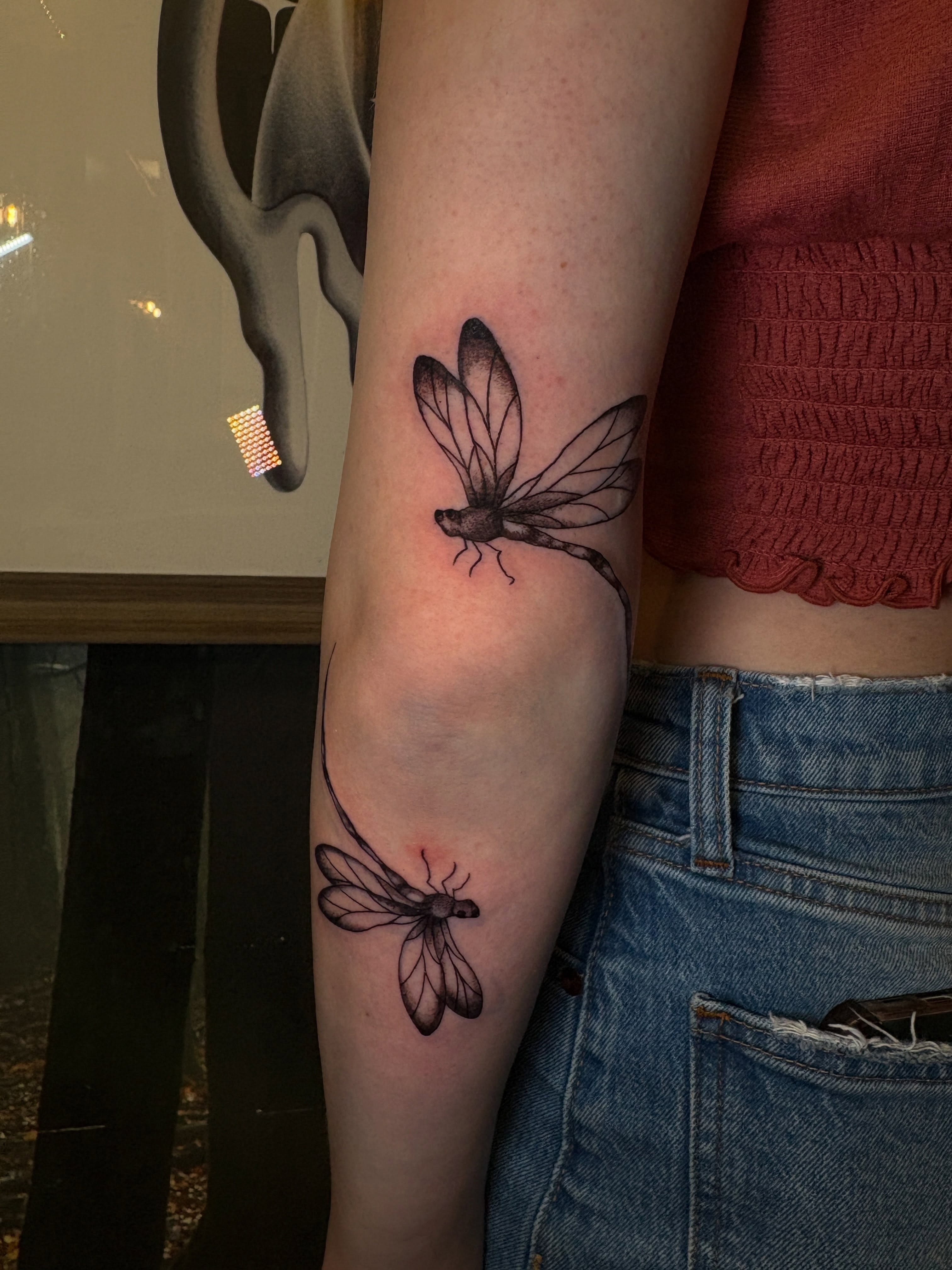 Dragonfly black and grey tattoo on the forearm by ⋆.˚ ☾ .⭒˚ alaina