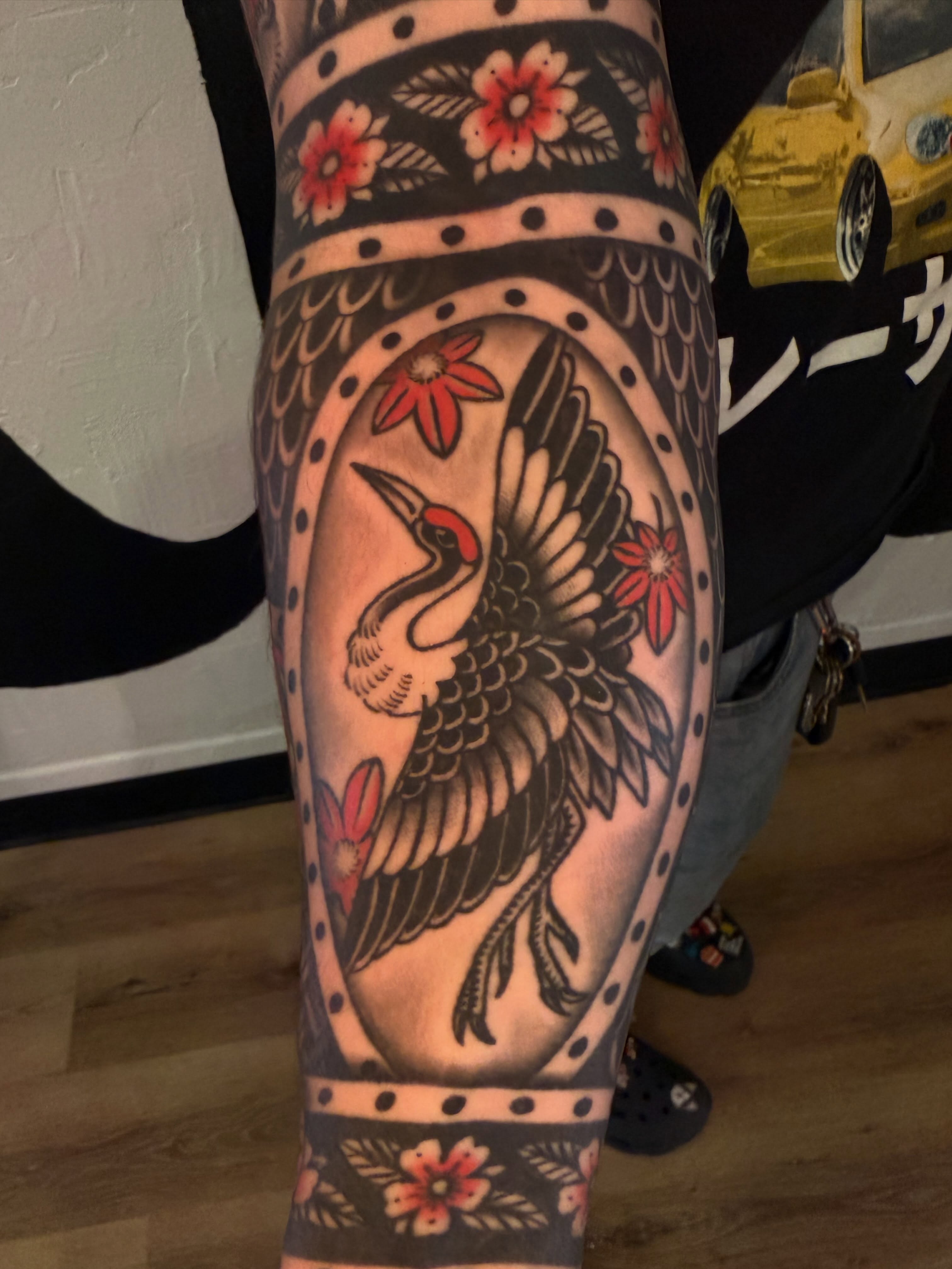 Woodpecker American traditional tattoo on the forearm by Cory Allen