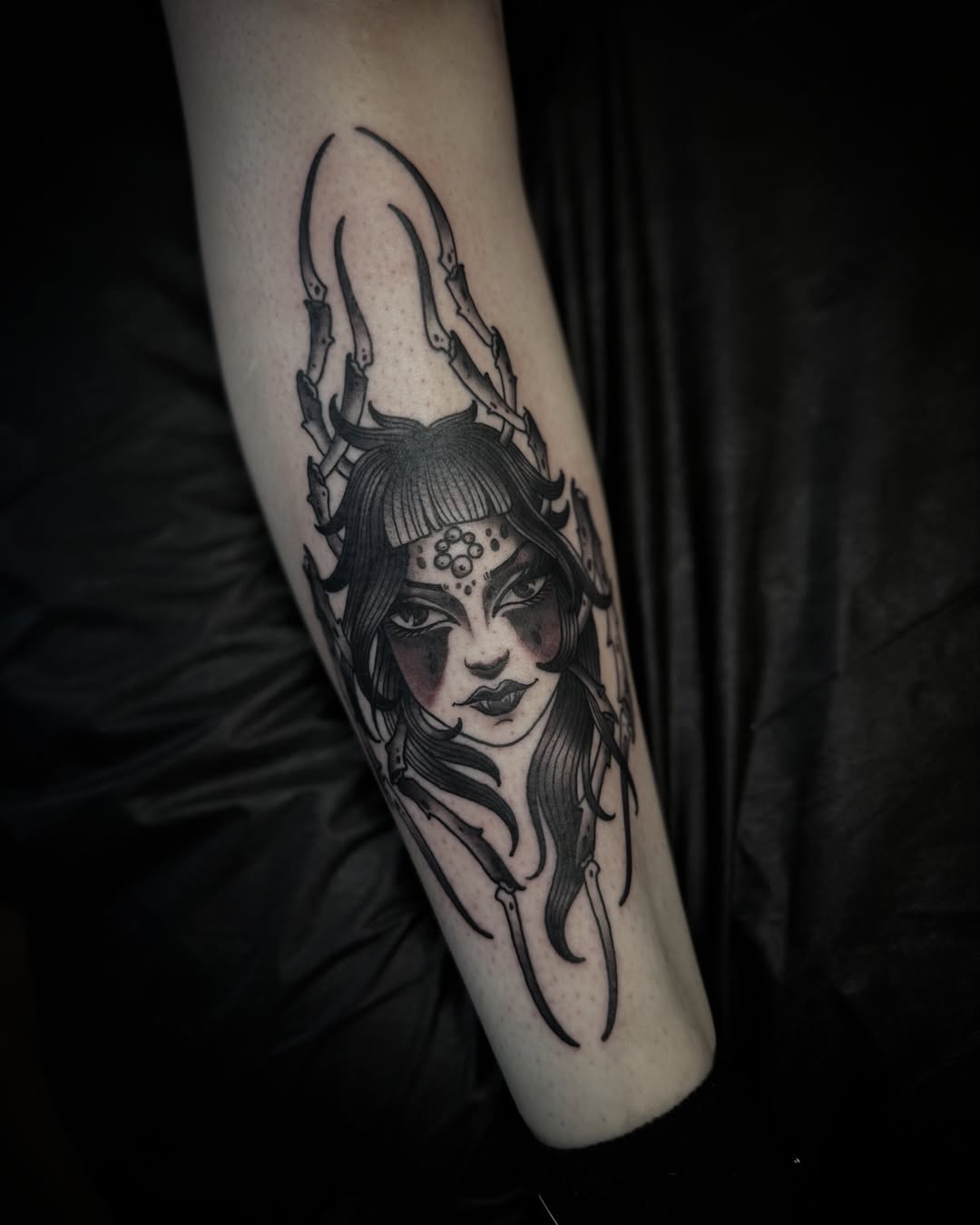 Woman with horns dark realism tattoo on the forearm by Chase Martines