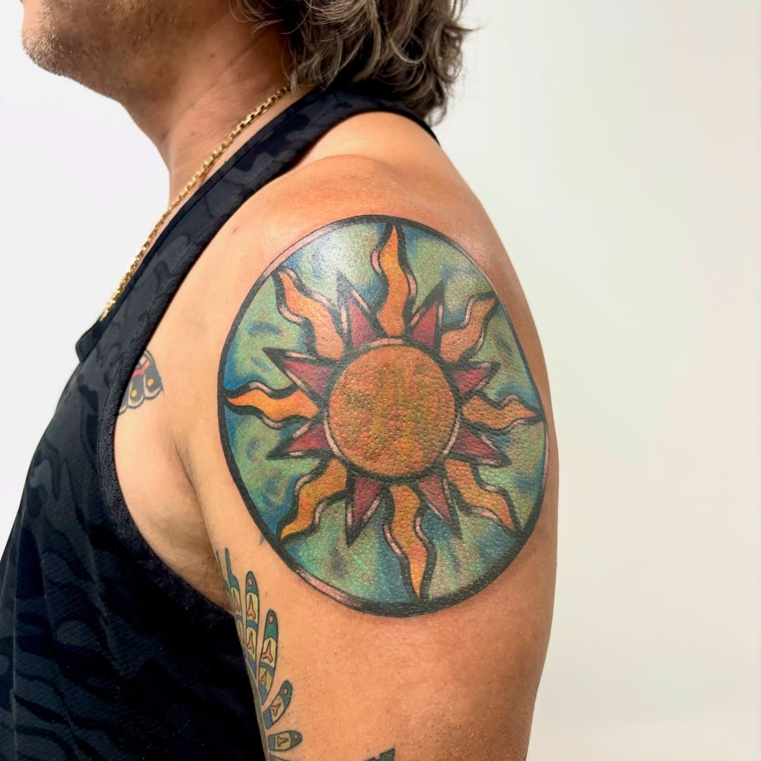 Sun American traditional tattoo on the shoulder by Taylor  Thompson