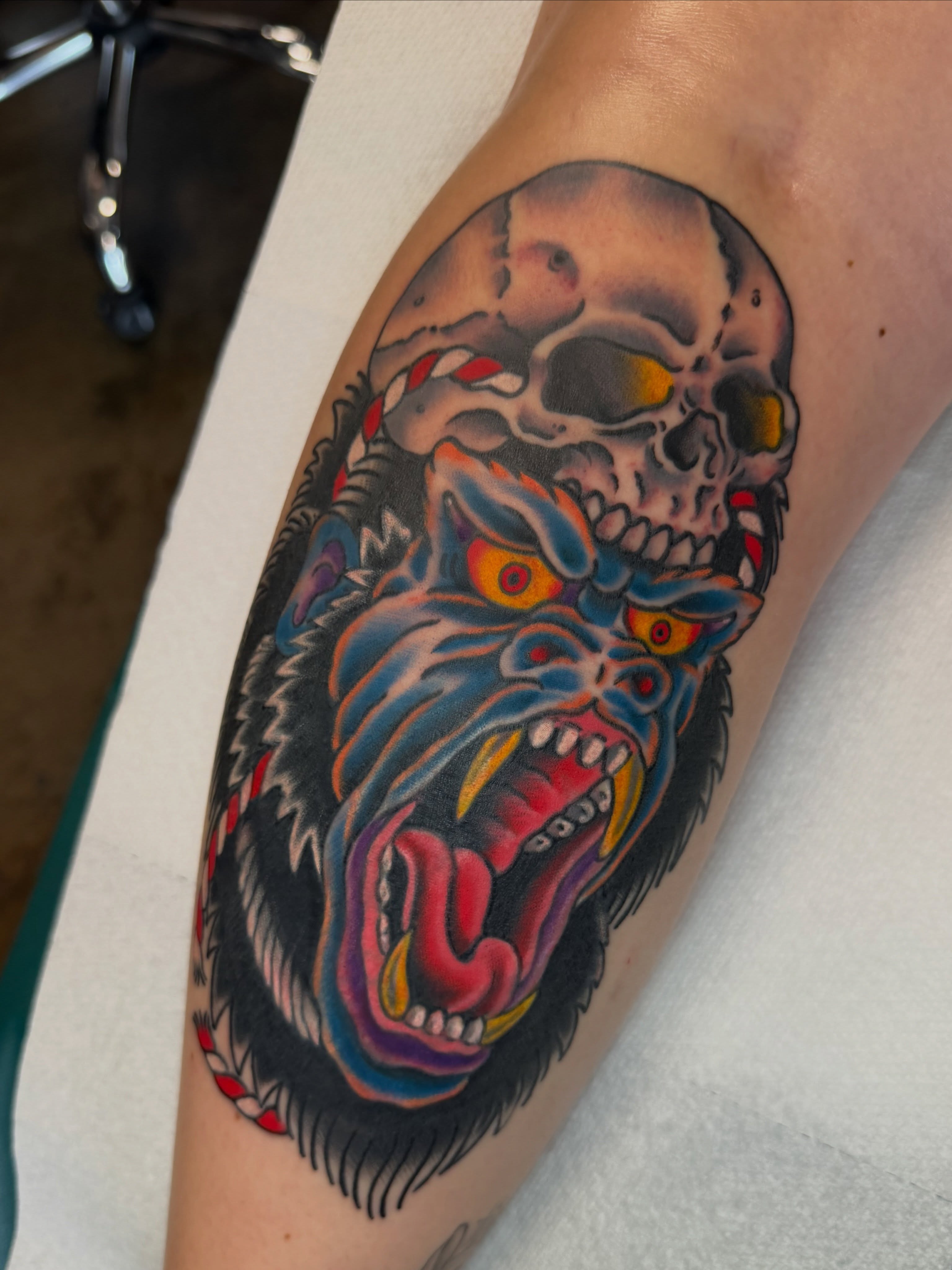 Skull and demon American traditional tattoo on the forearm by Christopher Mikesell