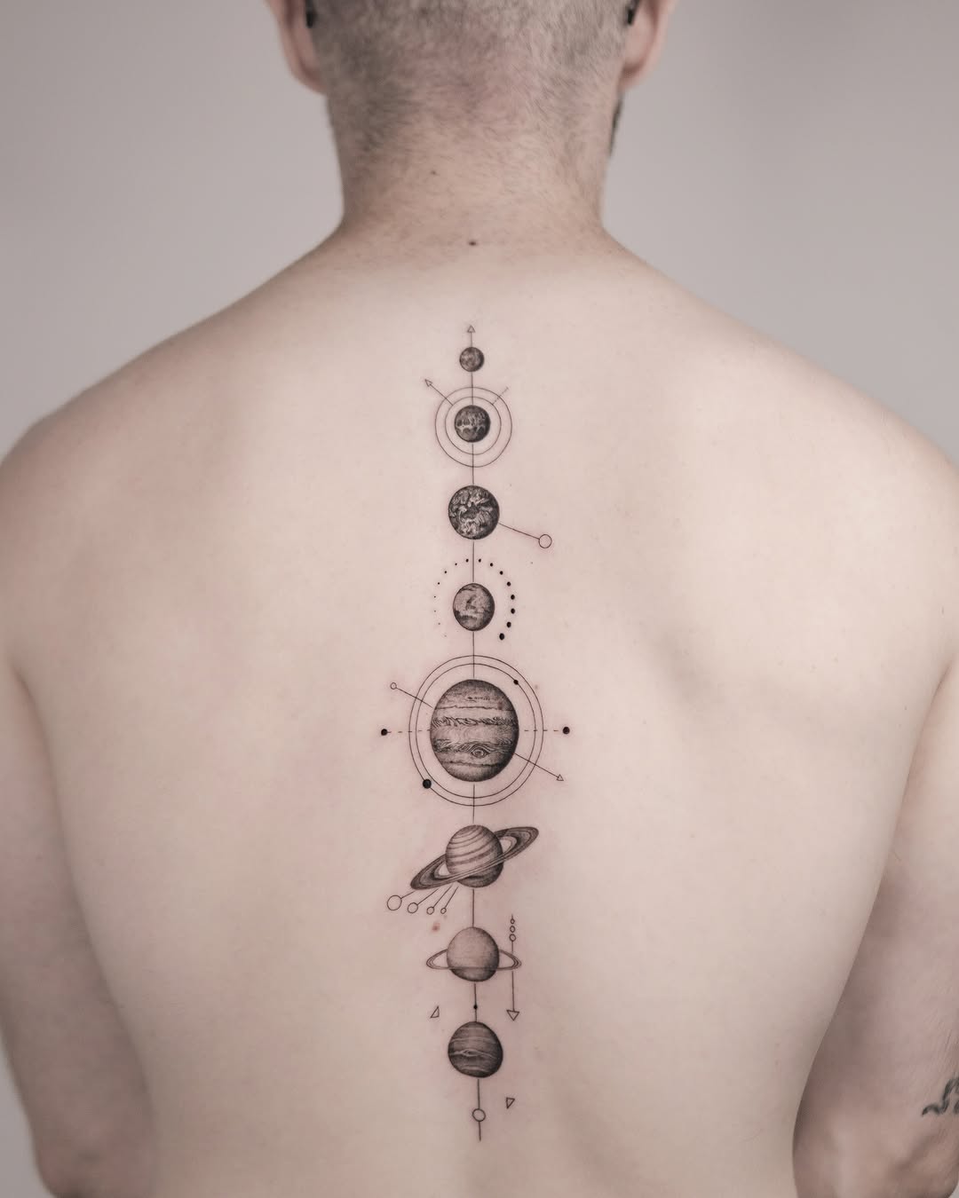 Solar system sketch tattoo on the back by Joey