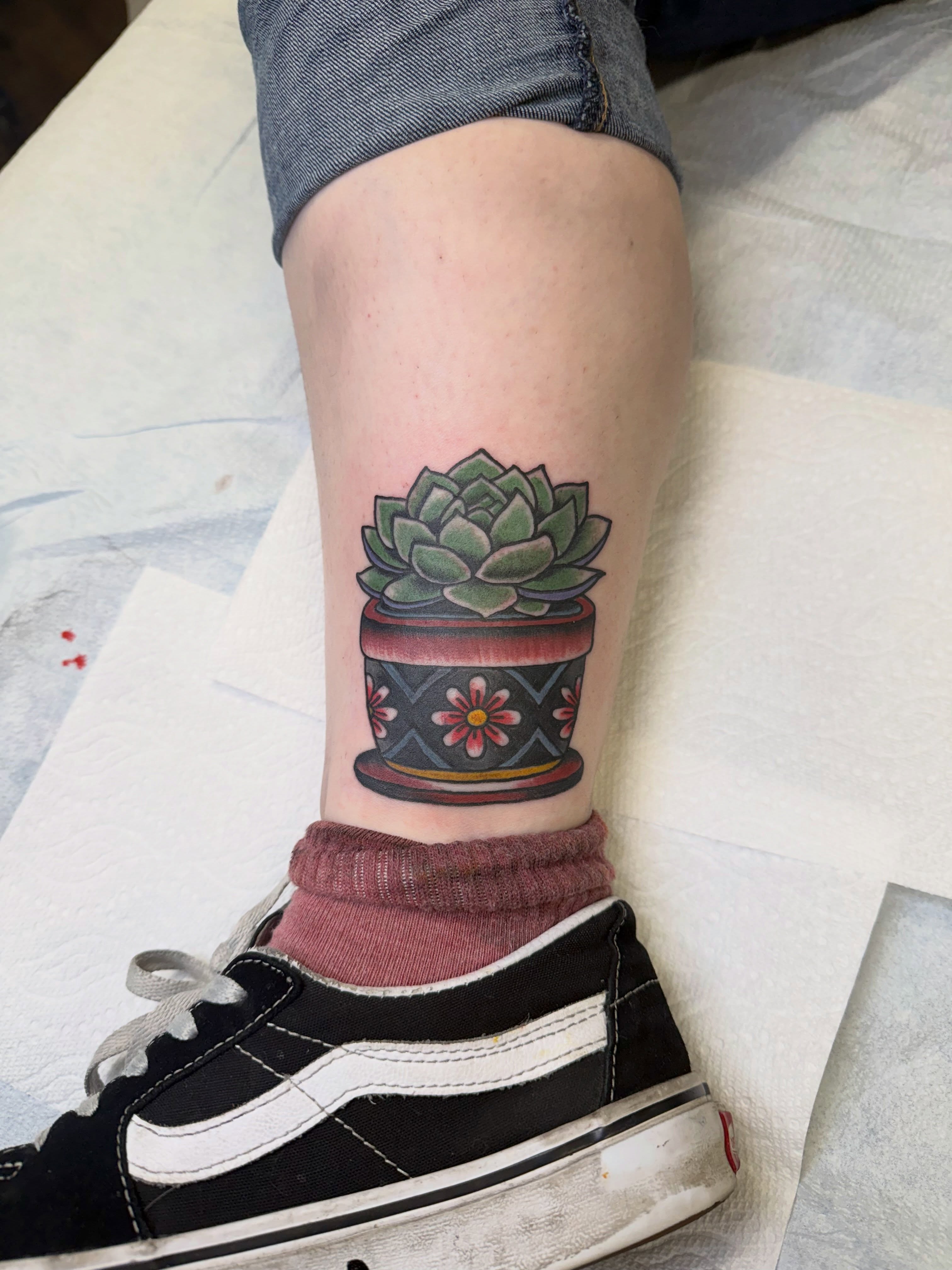 Succulent in pot realism tattoo on the calf by Aaron ulfstam