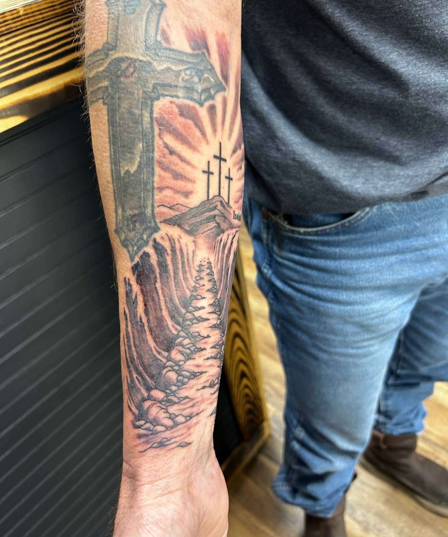 Religious landscape realism tattoo on the forearm by Abby Camacho - Tattoo Artist and Piercer โจ๐