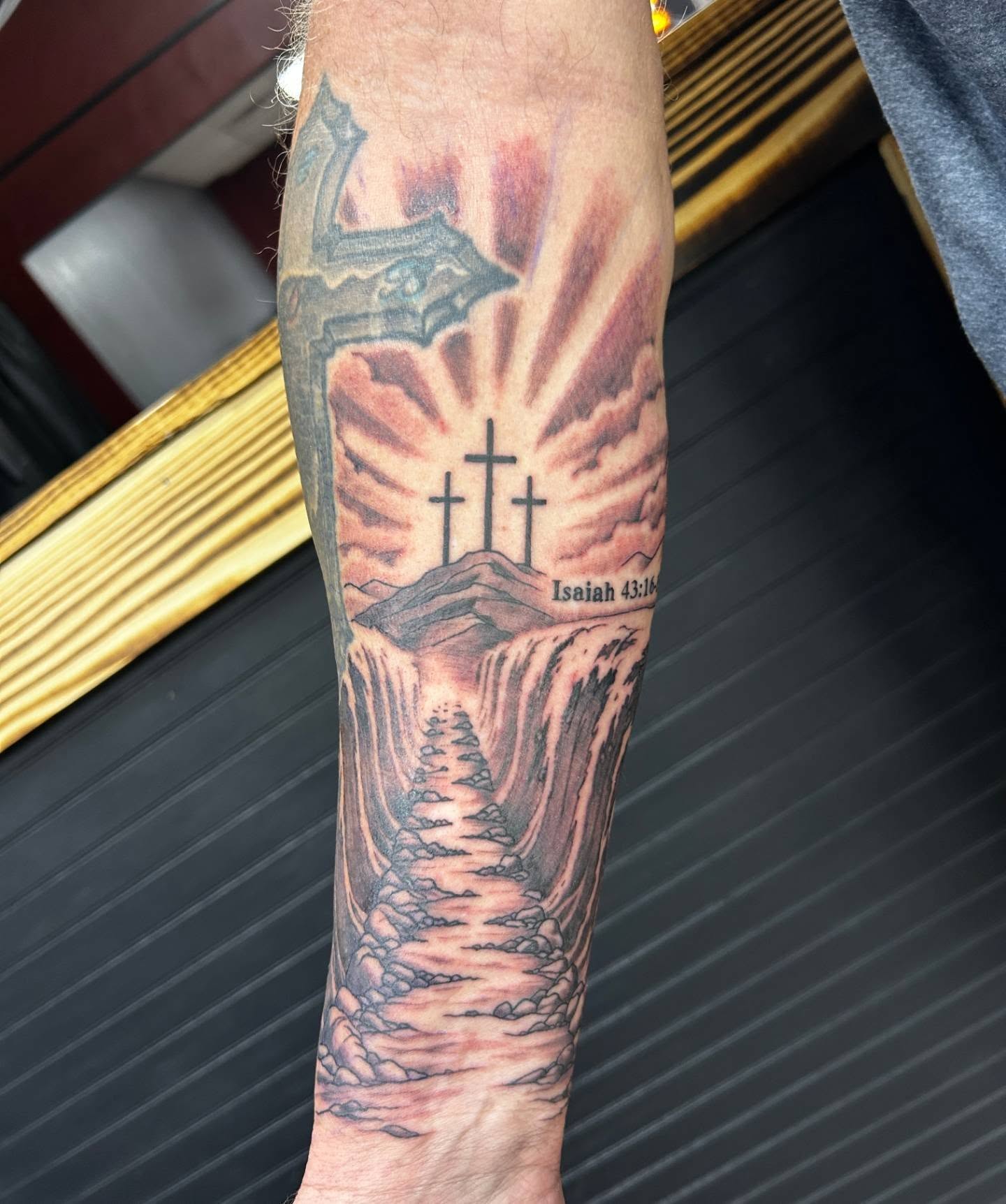Religious landscape realism tattoo on the forearm by Abby Camacho - Tattoo Artist and Piercer โจ๐