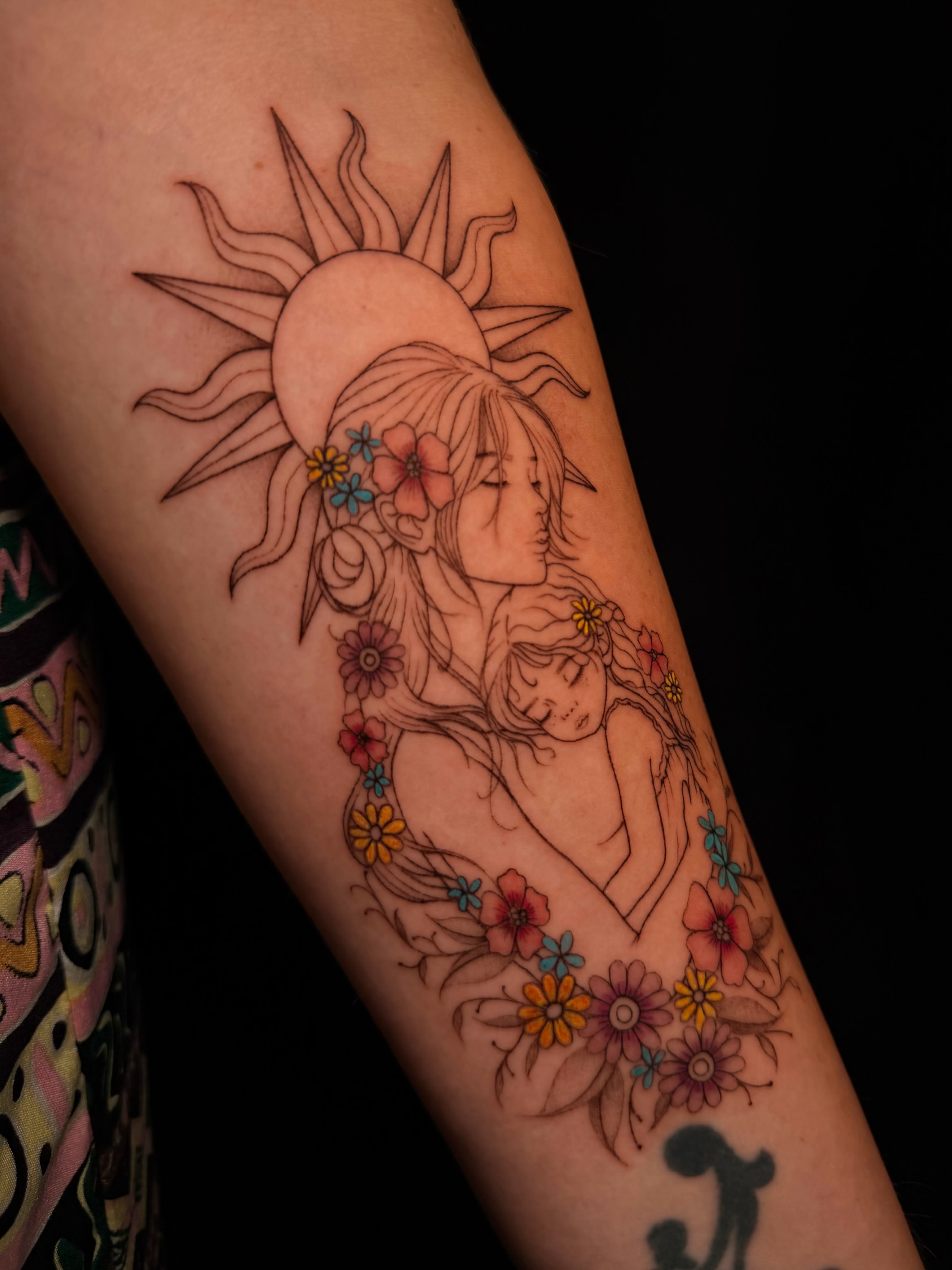 Mother and child new school tattoo on the forearm by Frida Tattooista