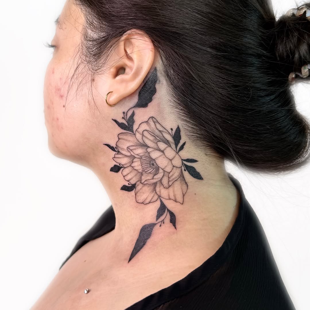 Flower black and grey tattoo on the neck by Nika