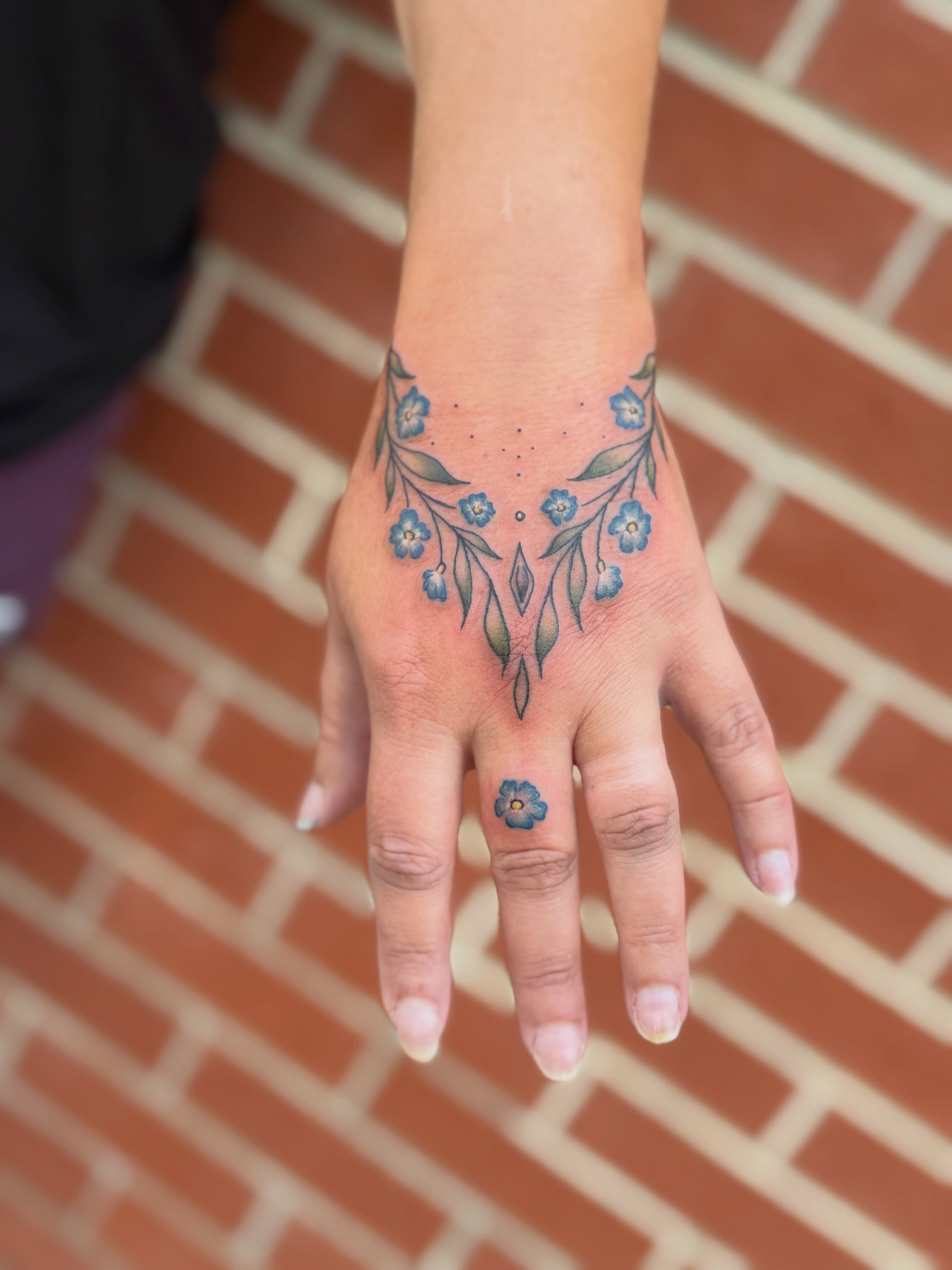 Blue flowers dotwork tattoo on the hand by Aly Rucker, Murfreesboro, Tennessee