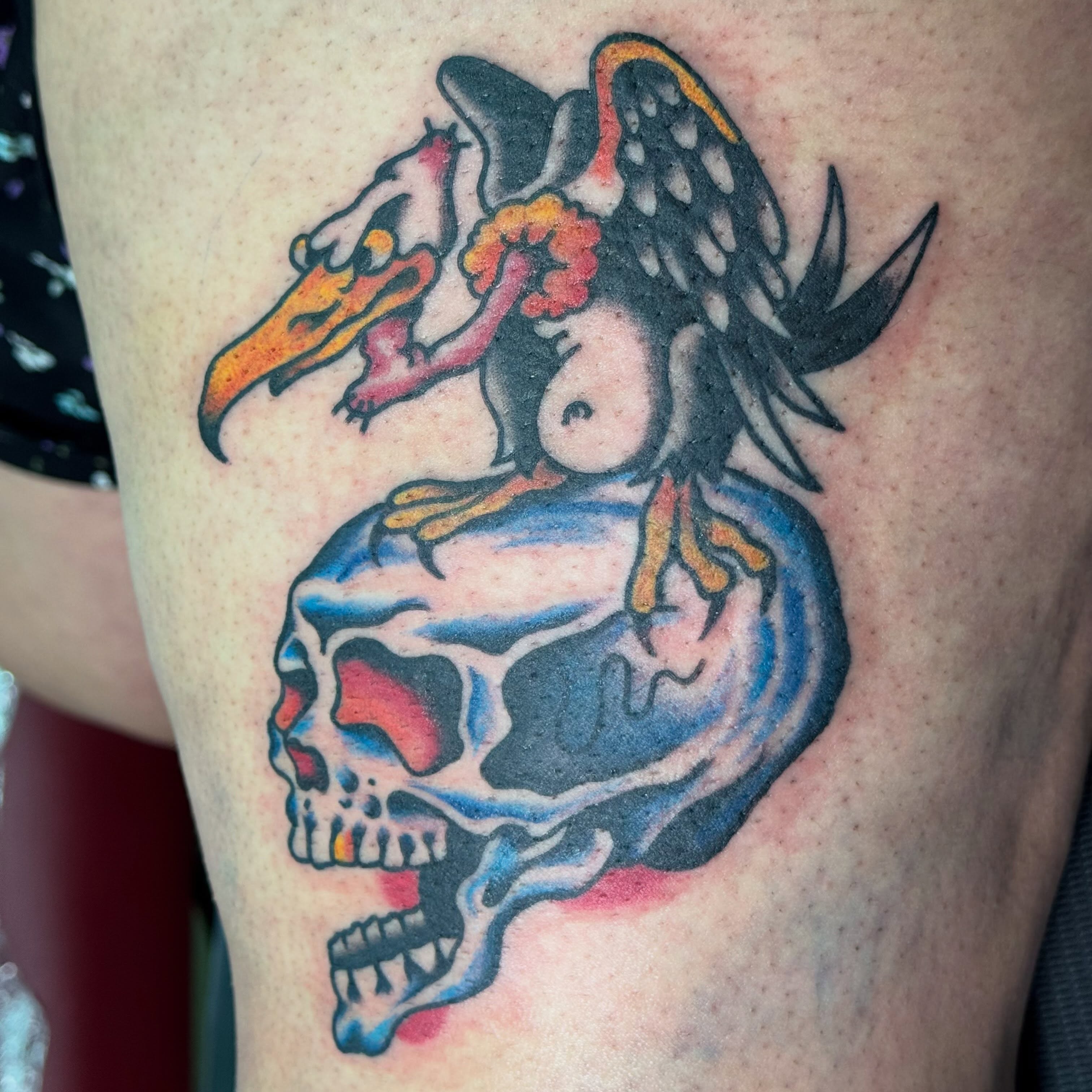 Skull with bird American traditional tattoo on the thigh by Jack Hatchet Tattoos