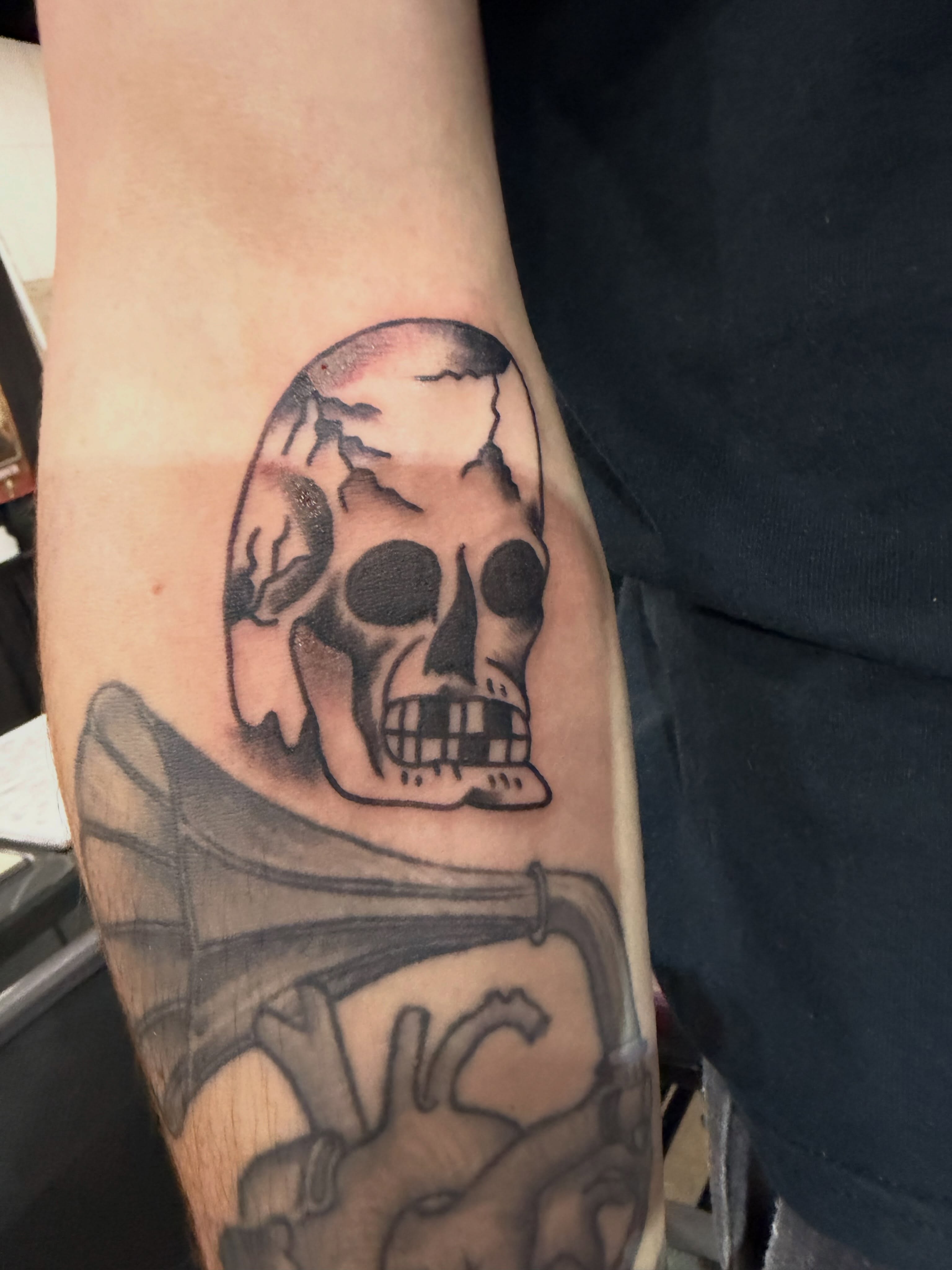 Skull black and grey tattoo on the forearm by P R O P H e T T R A V I S
