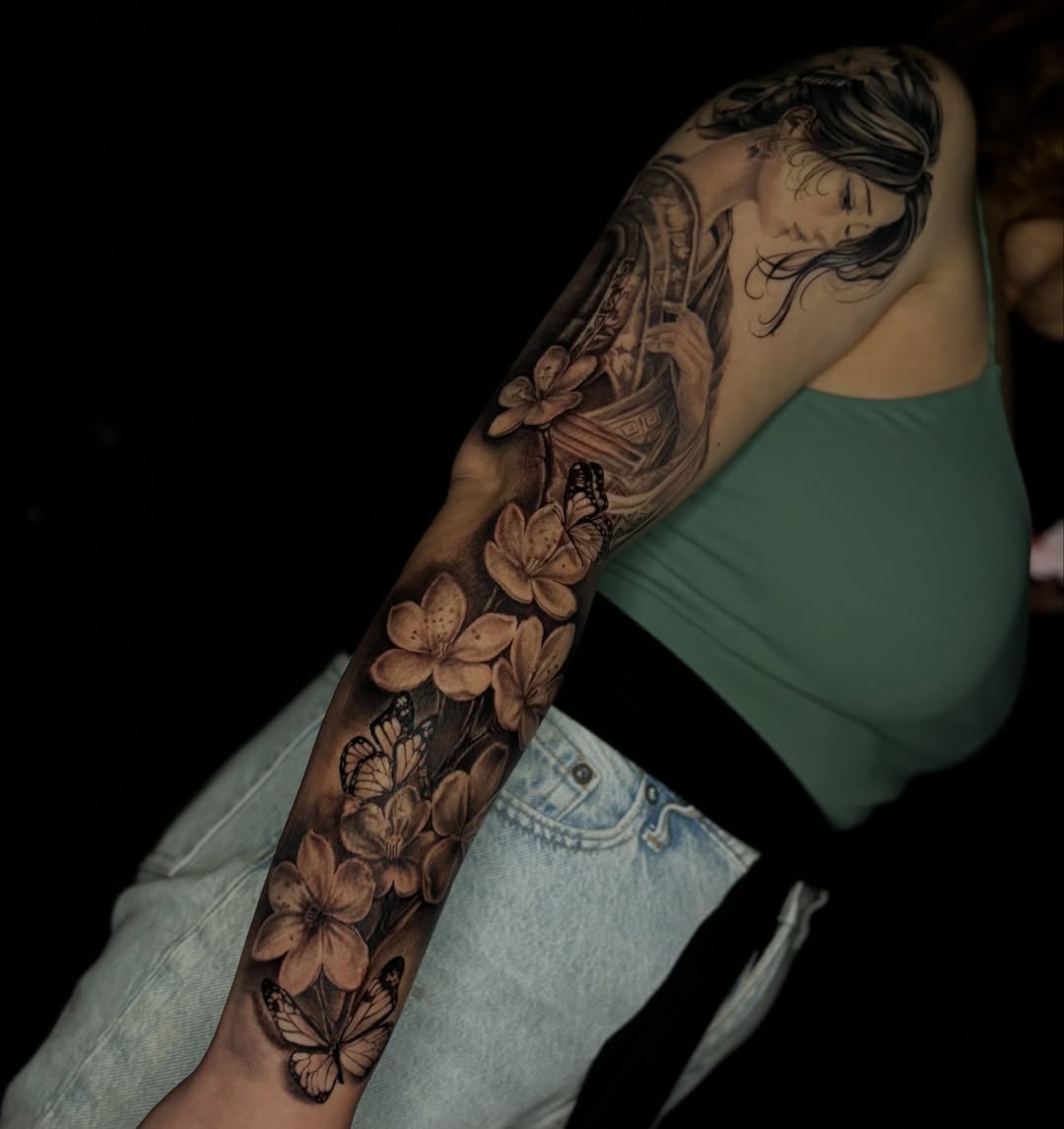 Cherry blossoms and butterflies realism tattoo on the forearm by @_frankyvee